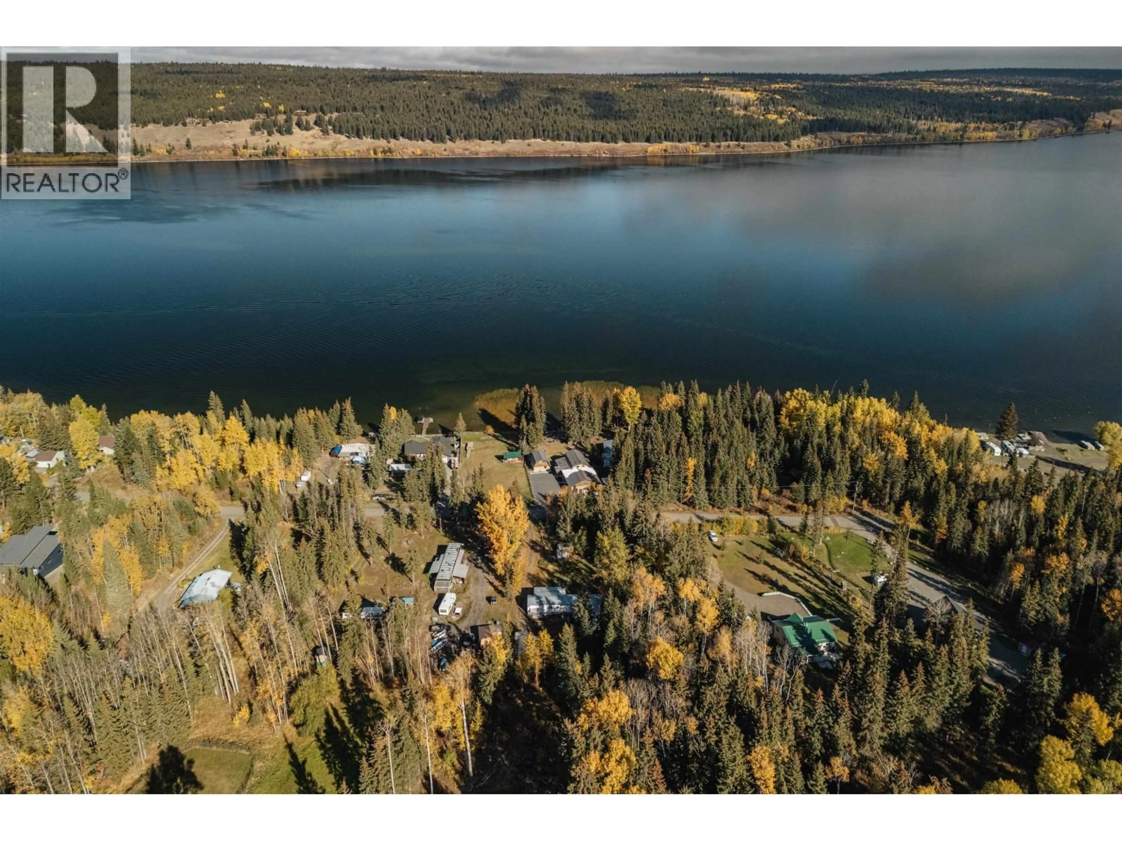 A pic from outside/outdoor area/front of a property/back of a property/a pic from drone, water/lake/river/ocean view for 6388 MULLIGAN DRIVE, 100 Mile House British Columbia V0K2E3