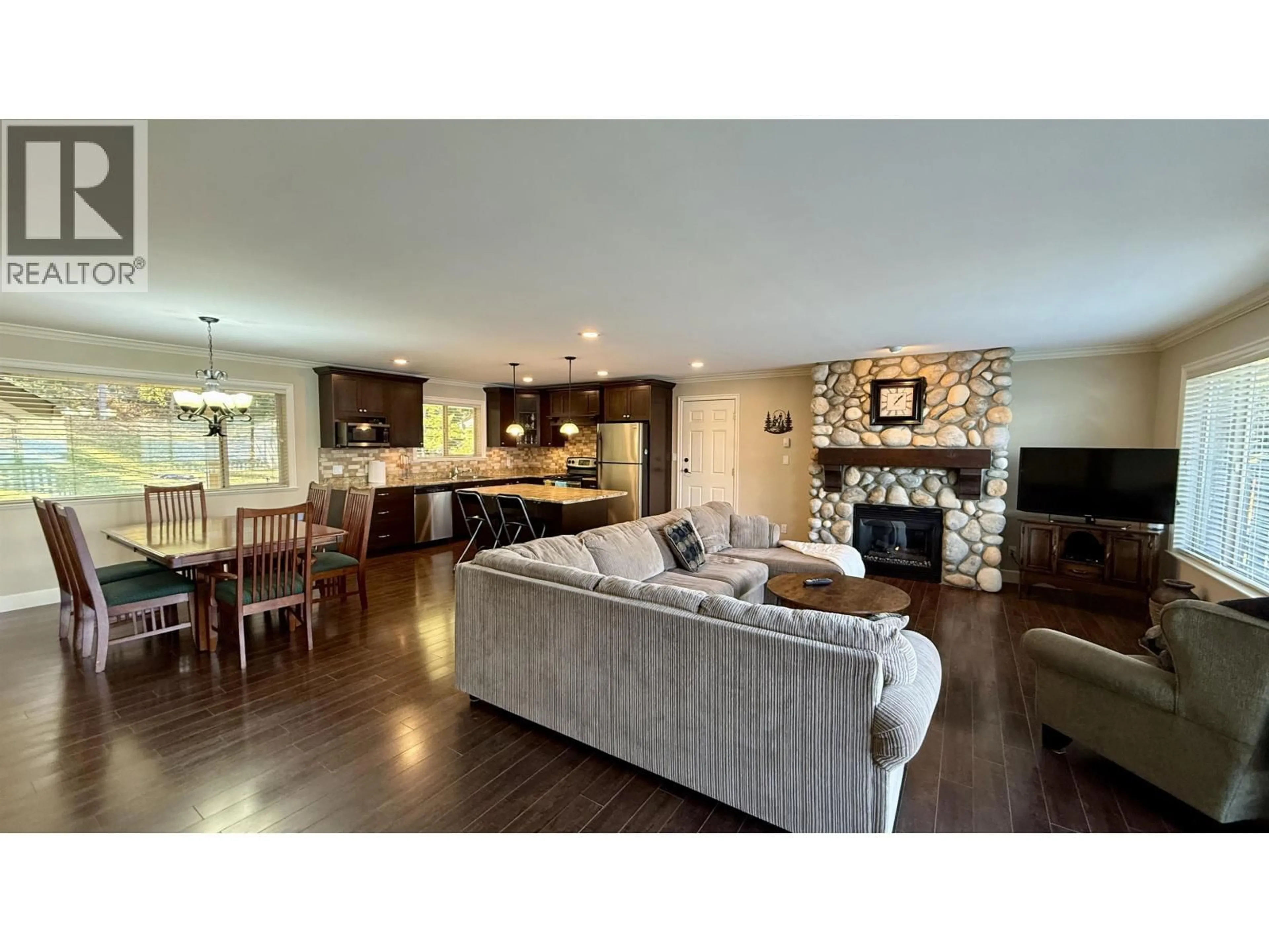 Open concept kitchen, wood/laminate floor for 4635 CAVERLY ROAD, Lac La Hache British Columbia V0K1T0