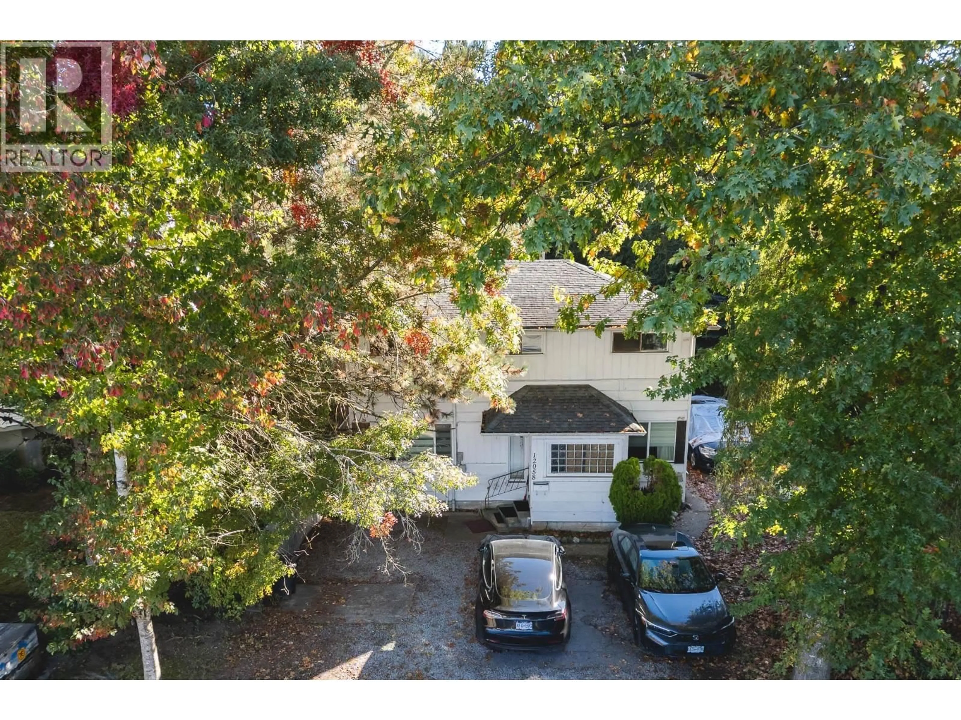 A pic from outside/outdoor area/front of a property/back of a property/a pic from drone, street for 12058 HARRIS ROAD, Pitt Meadows British Columbia V3Y2B5