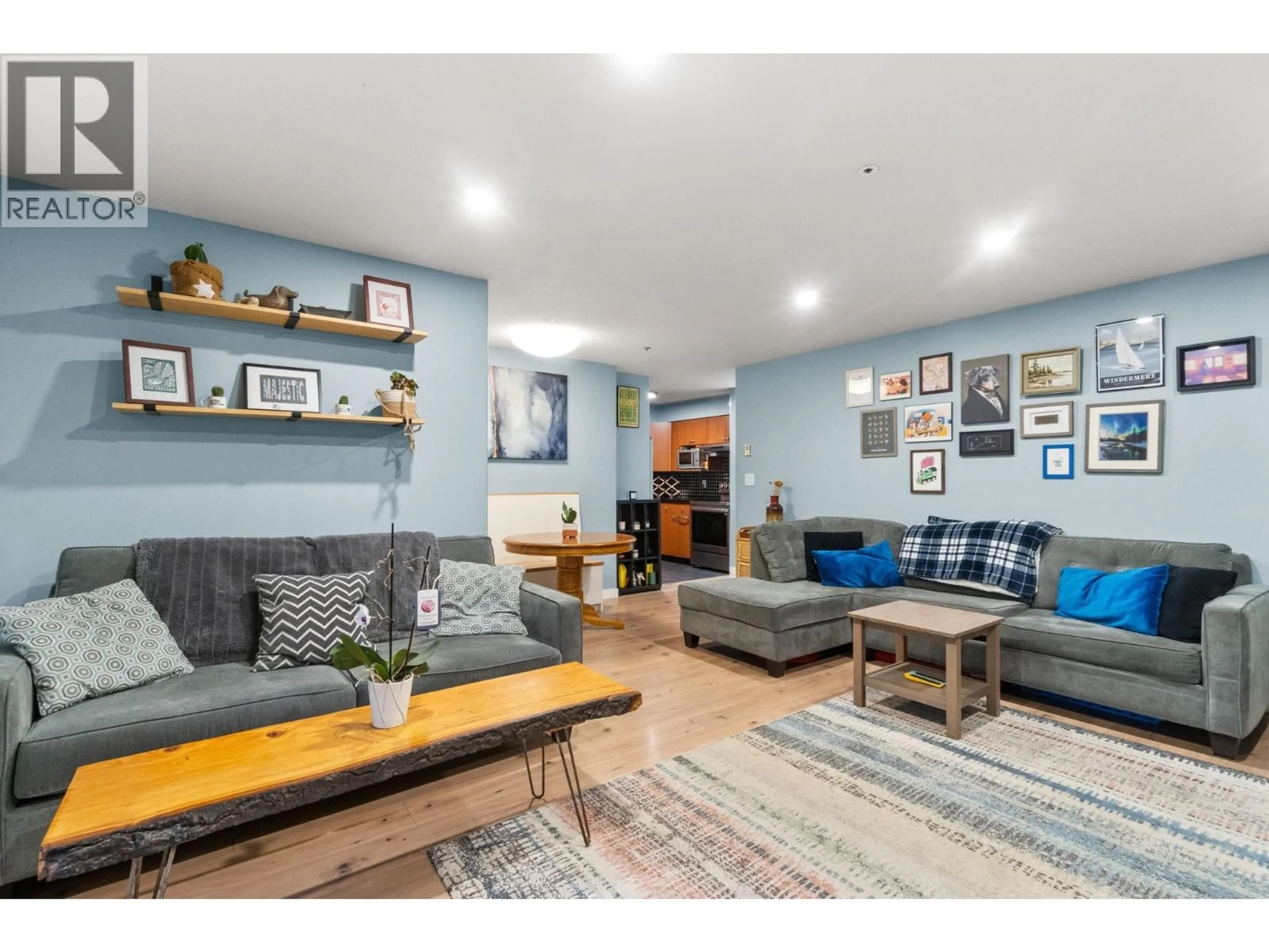 Living room with furniture, wood/laminate floor for 102 - 1689 4TH AVENUE, Vancouver British Columbia V5N1J7