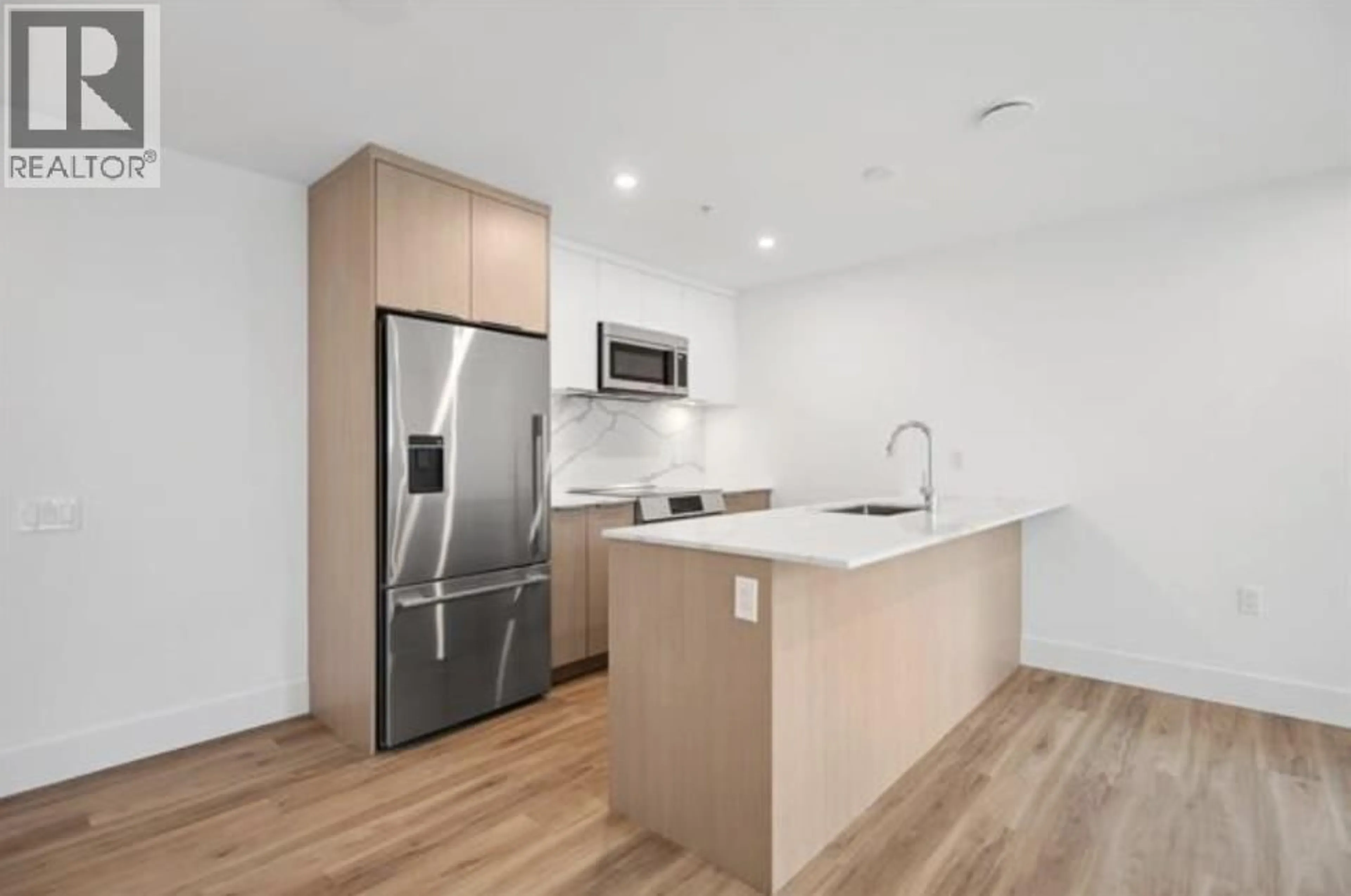 Open concept kitchen, unknown for 110 - 2085 1ST AVENUE, Vancouver British Columbia V5N1B6