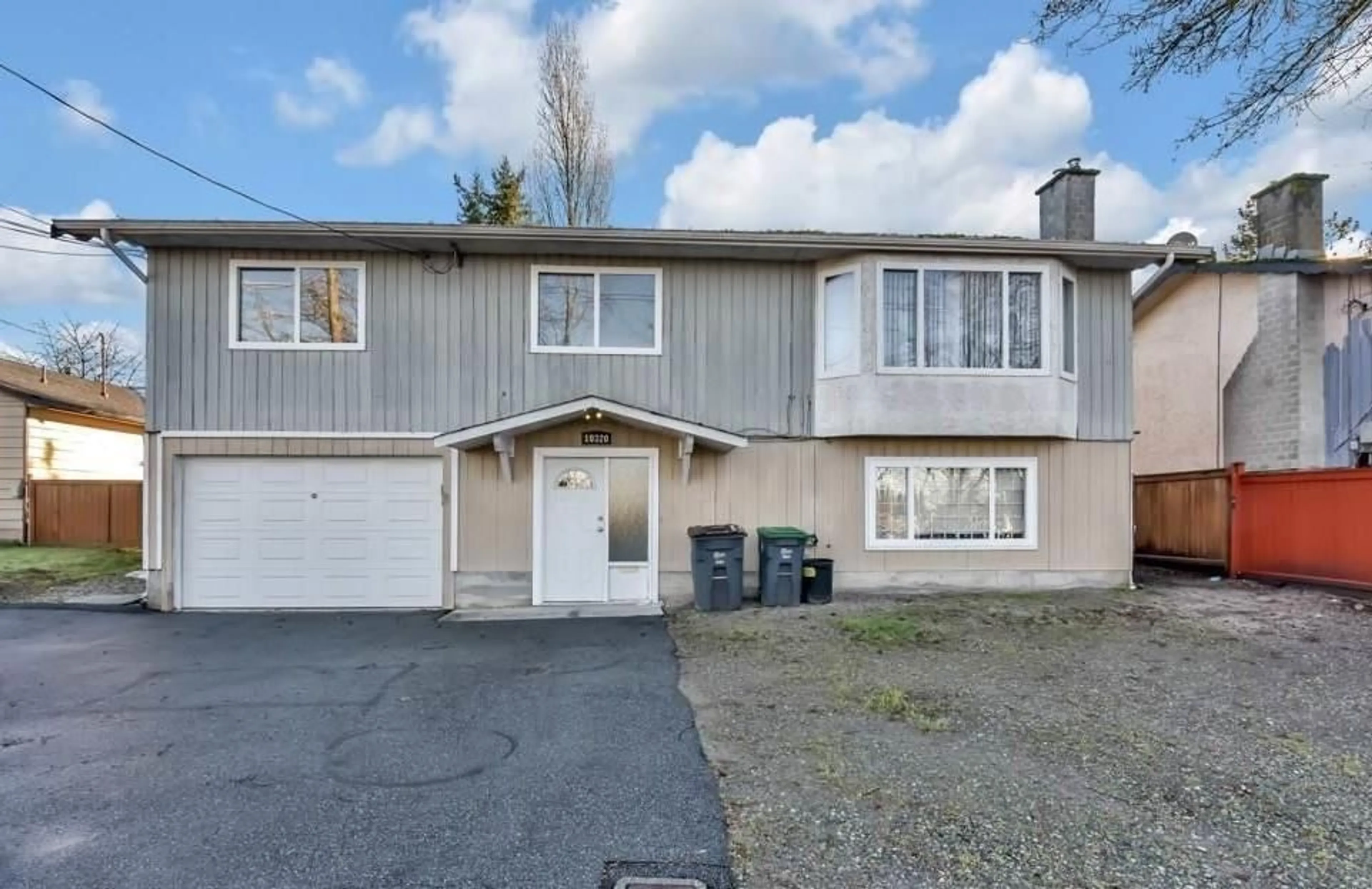 Home with vinyl exterior material, street for 10320 140, Surrey British Columbia V3T4X9