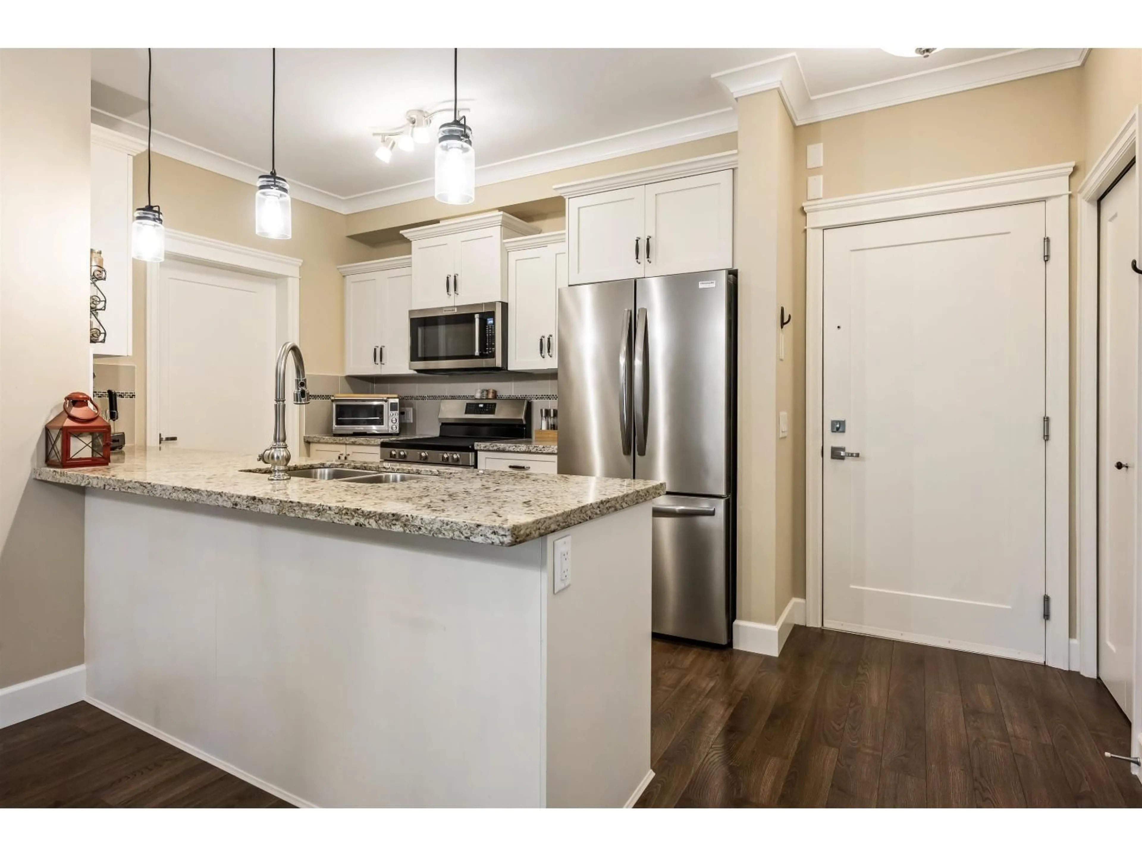 Open concept kitchen, wood/laminate floor for 305 - 45750 KEITH WILSON ROAD, Chilliwack British Columbia V2R0X3