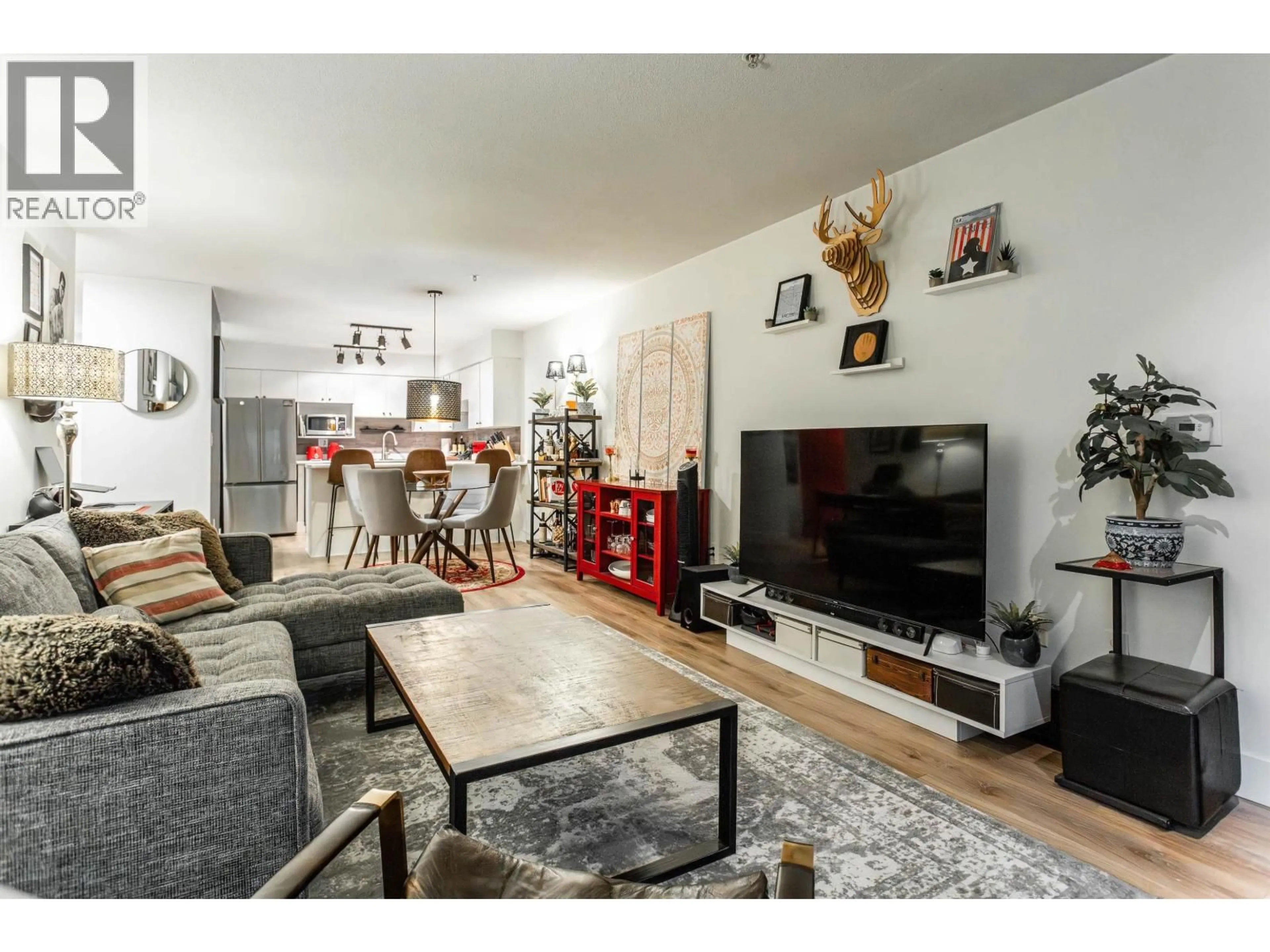 Living room with furniture, wood/laminate floor for 109 - 1215 PACIFIC STREET, Coquitlam British Columbia V3B7M4