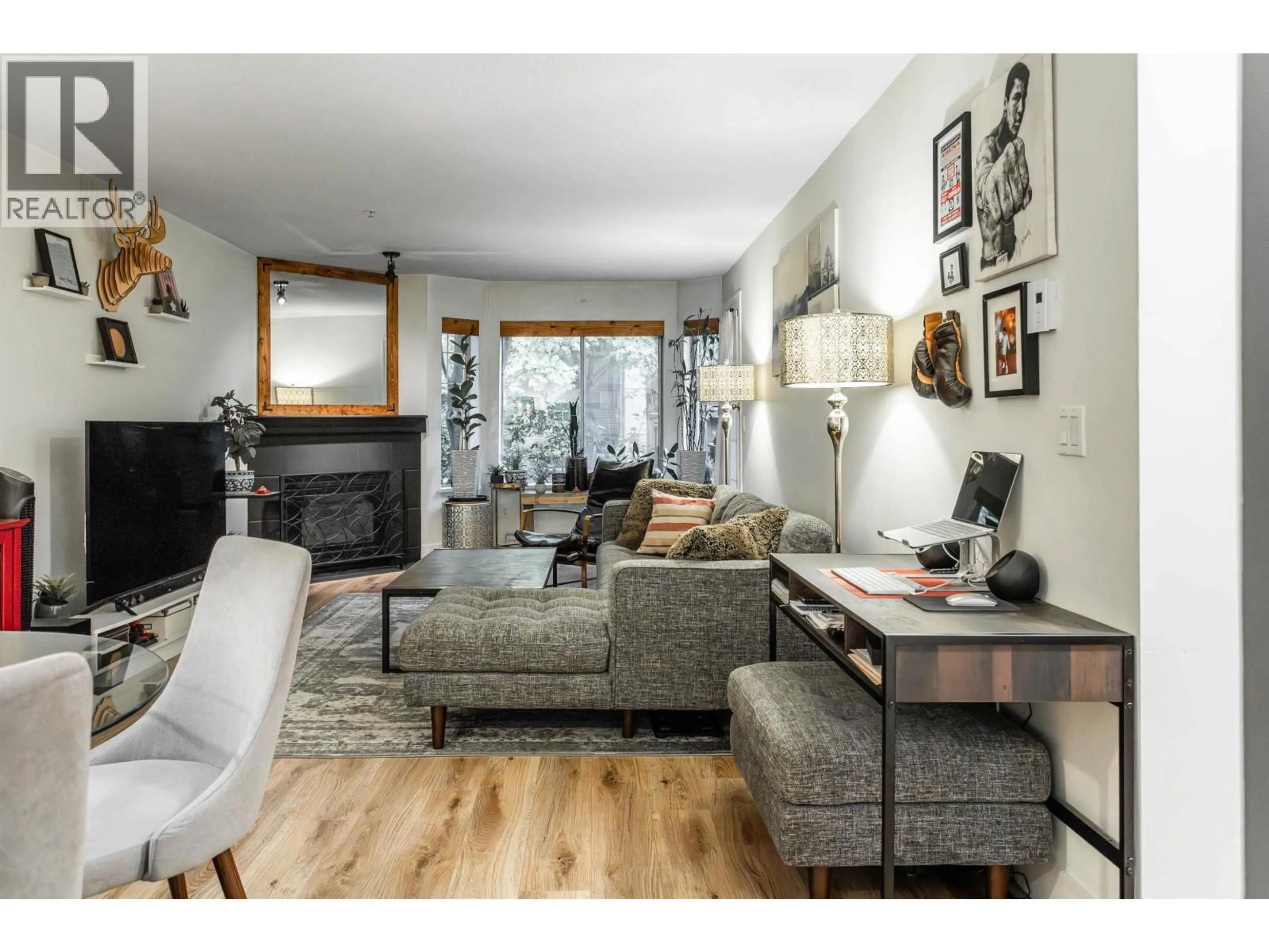 Living room with furniture, wood/laminate floor for 109 - 1215 PACIFIC STREET, Coquitlam British Columbia V3B7M4