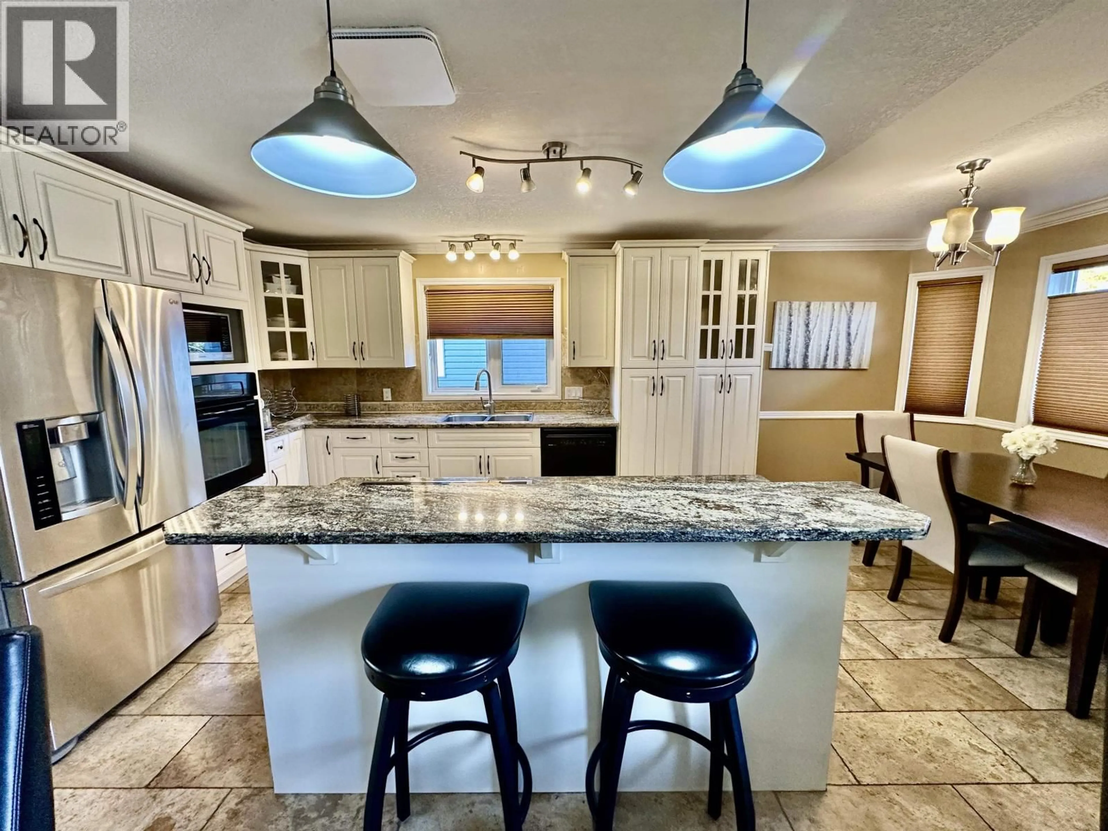 Open concept kitchen, ceramic/tile floor for 10504 114 AVENUE, Fort St. John British Columbia V1J6K9