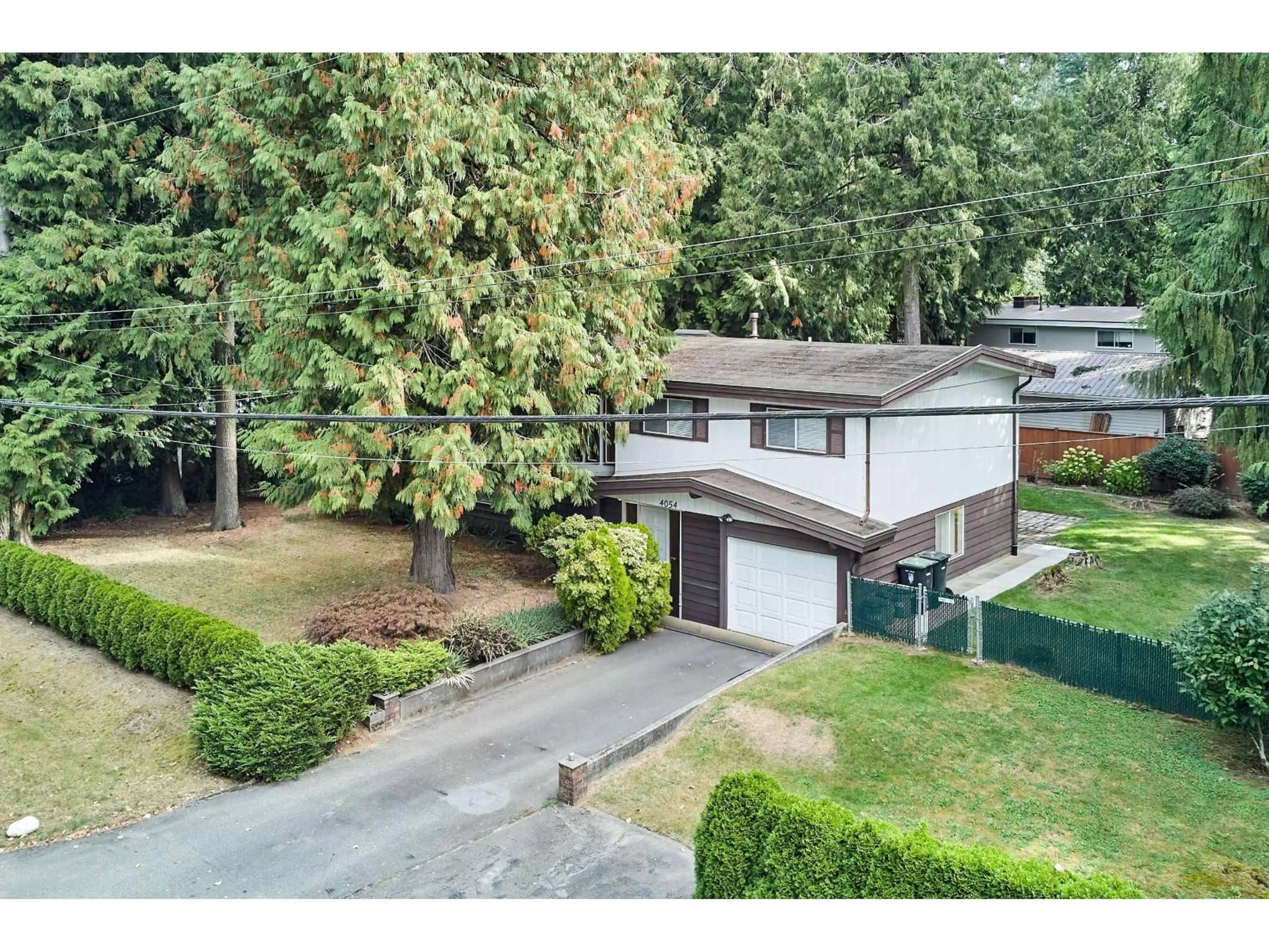 A pic from outside/outdoor area/front of a property/back of a property/a pic from drone, unknown for 4054 196, Langley British Columbia V3A1A1