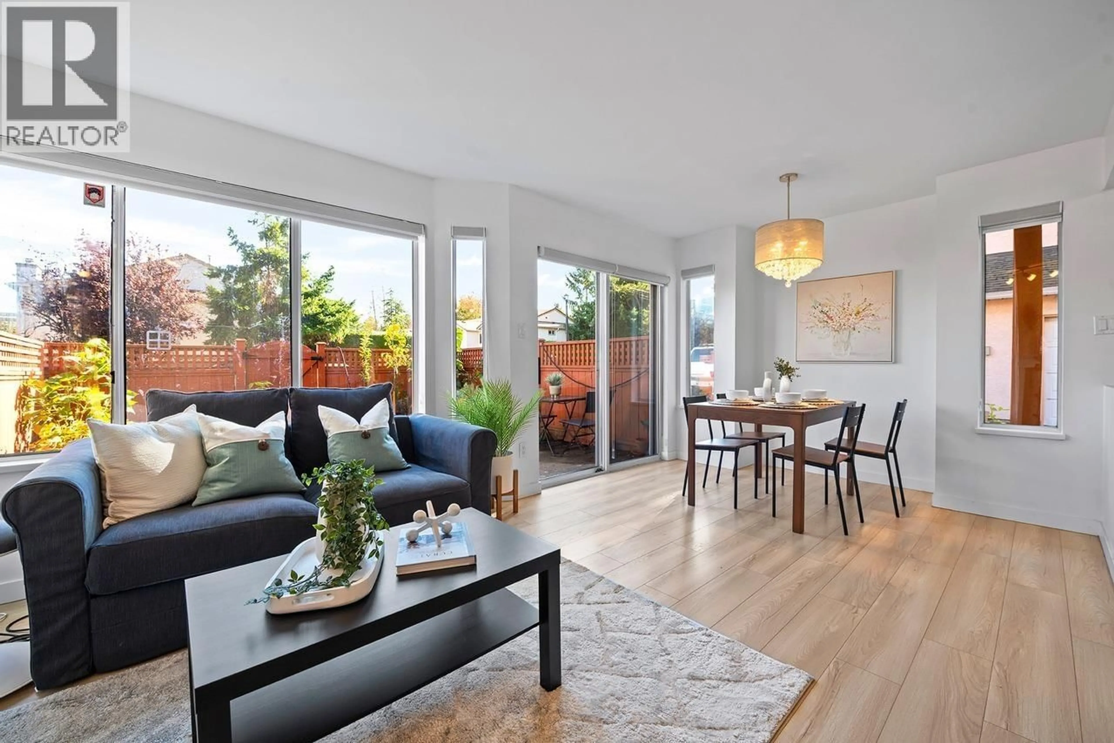 Living room with furniture, wood/laminate floor for 1 - 7231 MOFFATT ROAD, Richmond British Columbia V6Y1X9