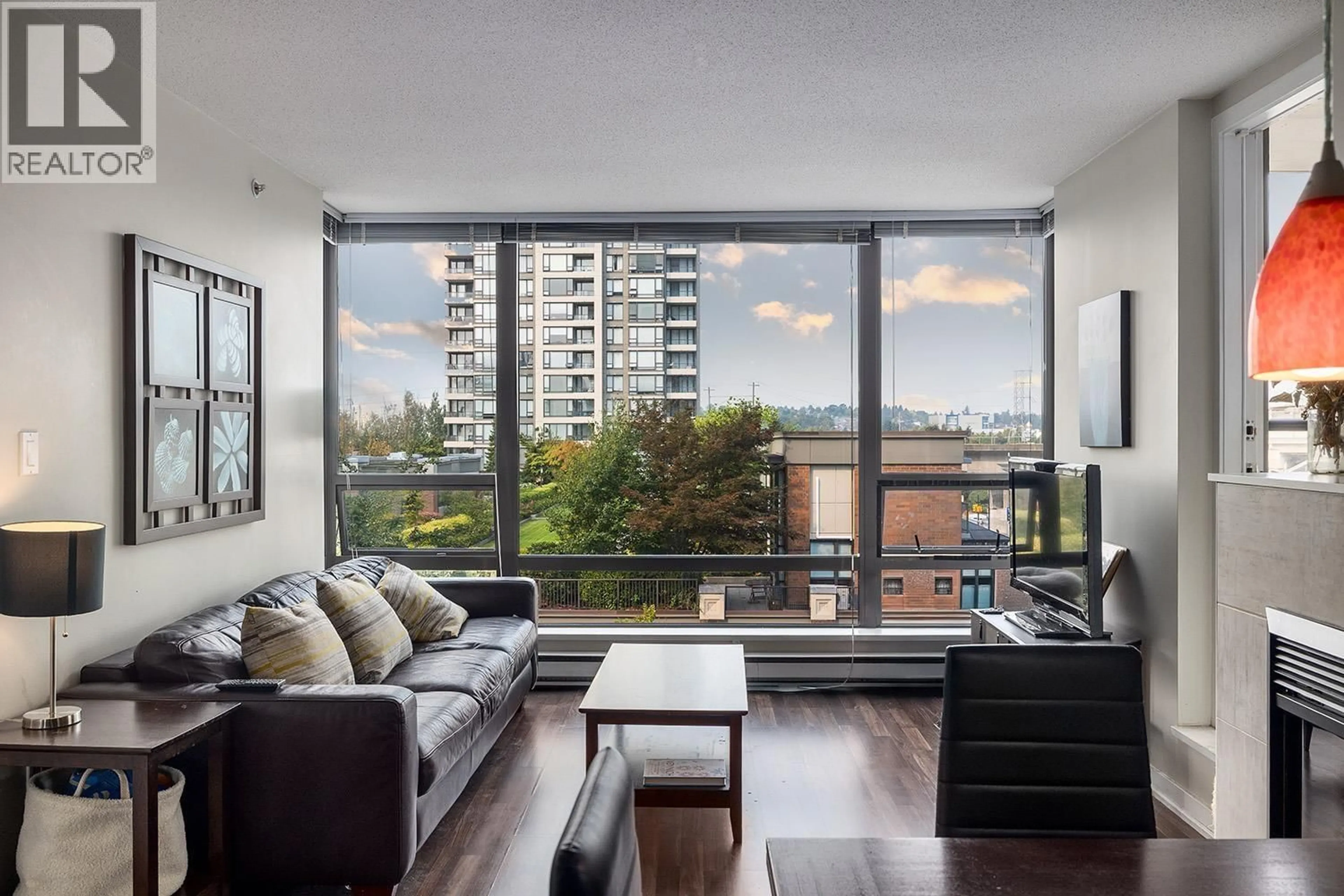 Living room with furniture, wood/laminate floor for 506 - 4182 DAWSON STREET, Burnaby British Columbia V5C0A2