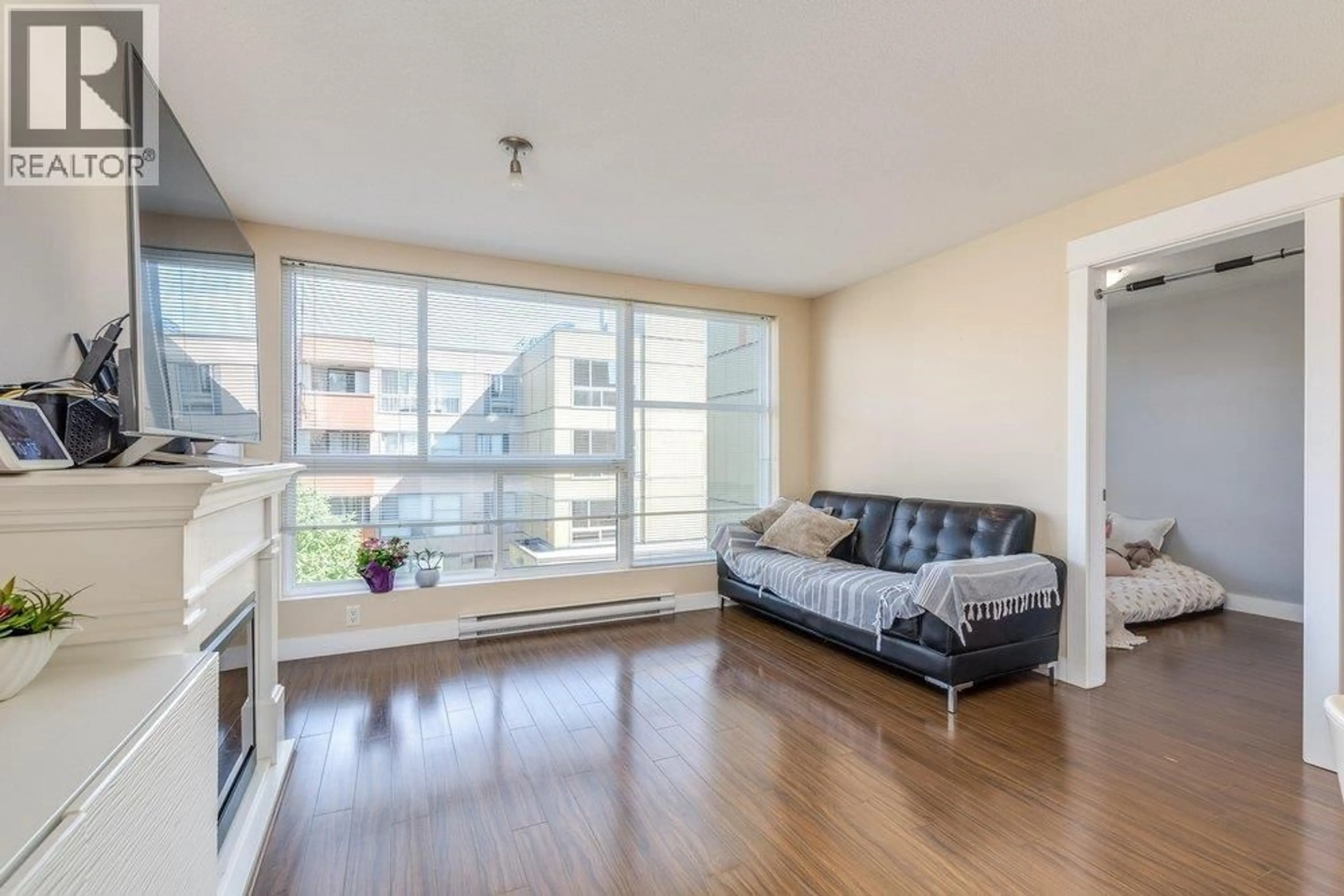 Living room with furniture, wood/laminate floor for 313 - 12075 228 STREET, Maple Ridge British Columbia V2X6M2