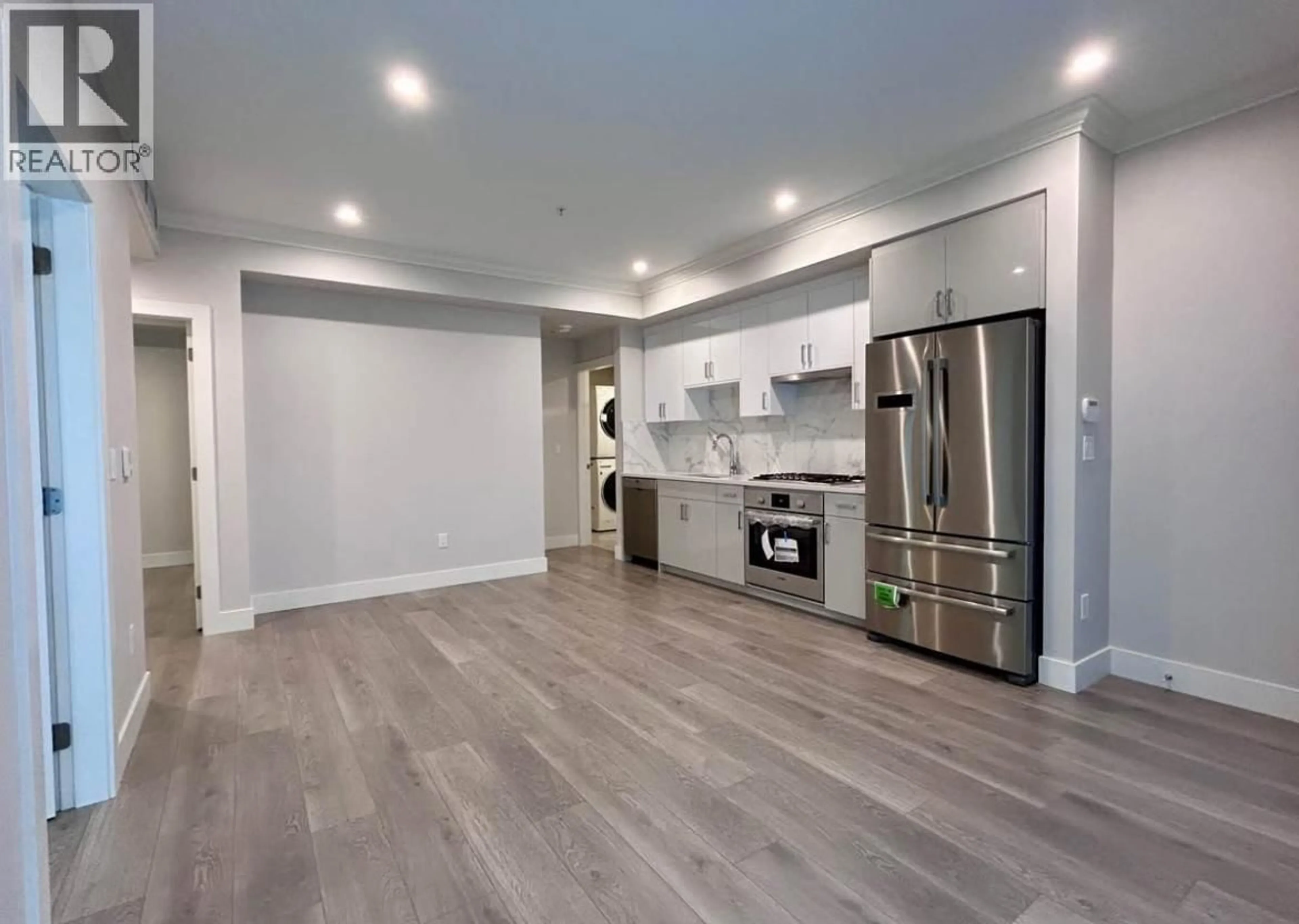 Open concept kitchen, wood/laminate floor for 38 - 7567 OAK STREET, Vancouver British Columbia V6P4A4