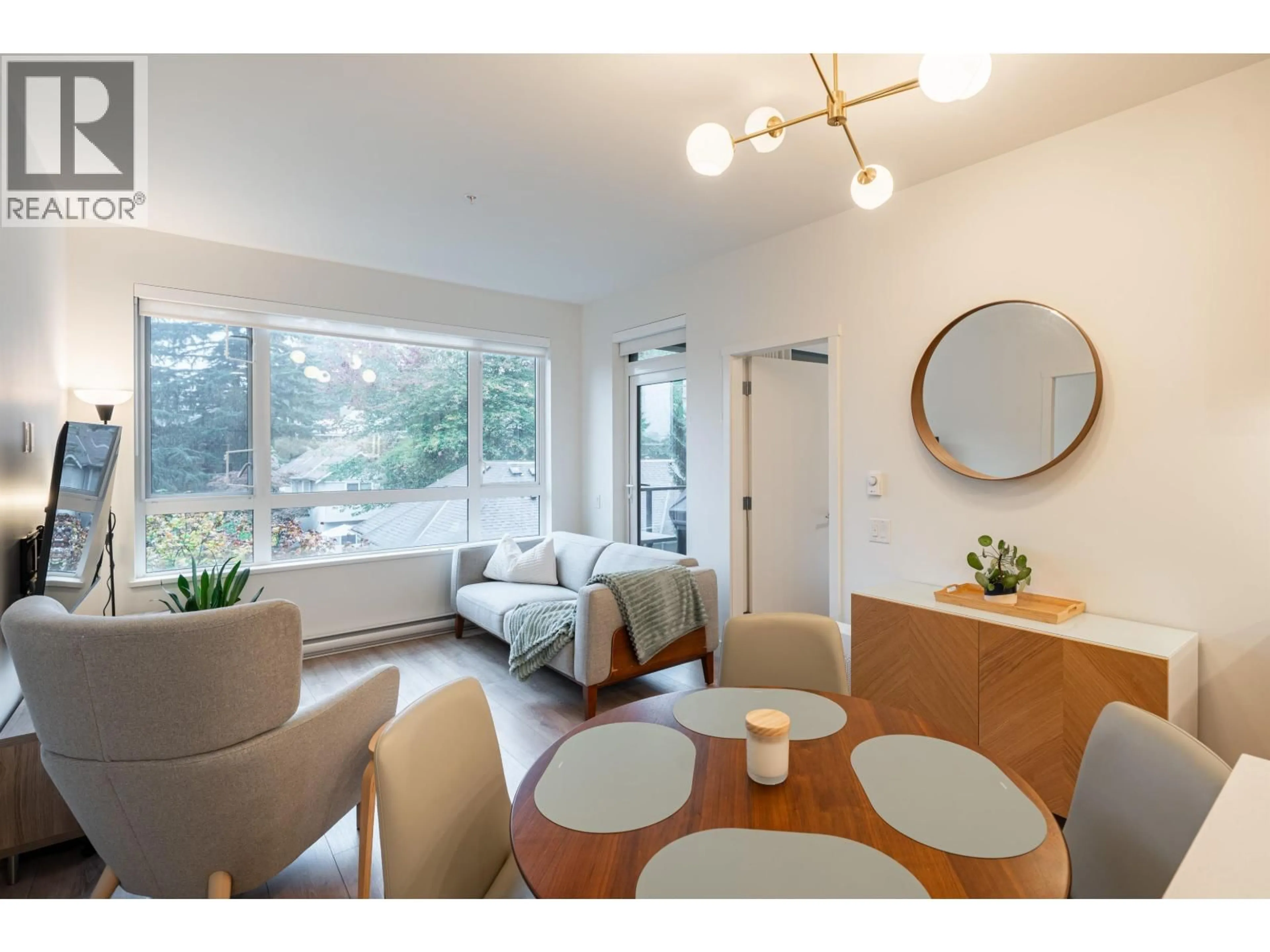 Living room with furniture, wood/laminate floor for 310 - 741 ANSKAR COURT, Coquitlam British Columbia V3J0N3