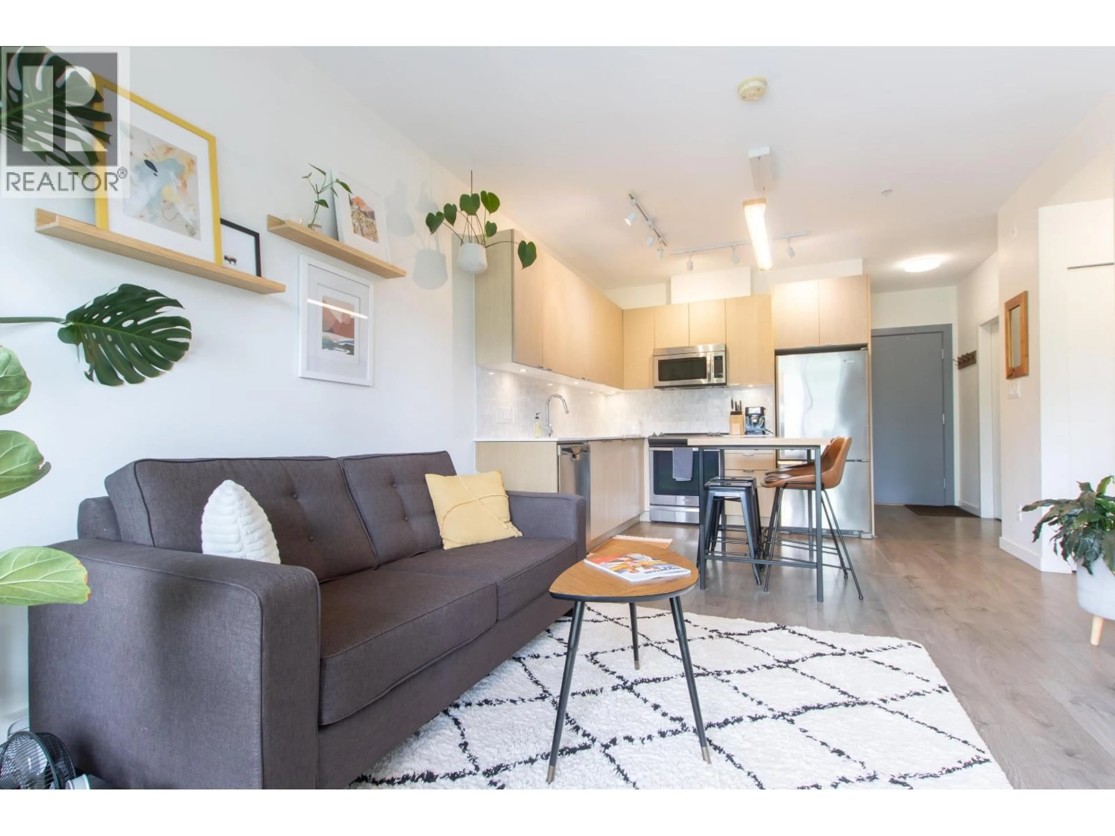 Living room with furniture, wood/laminate floor for 407 - 1150 BAILEY STREET, Squamish British Columbia V8B0R4