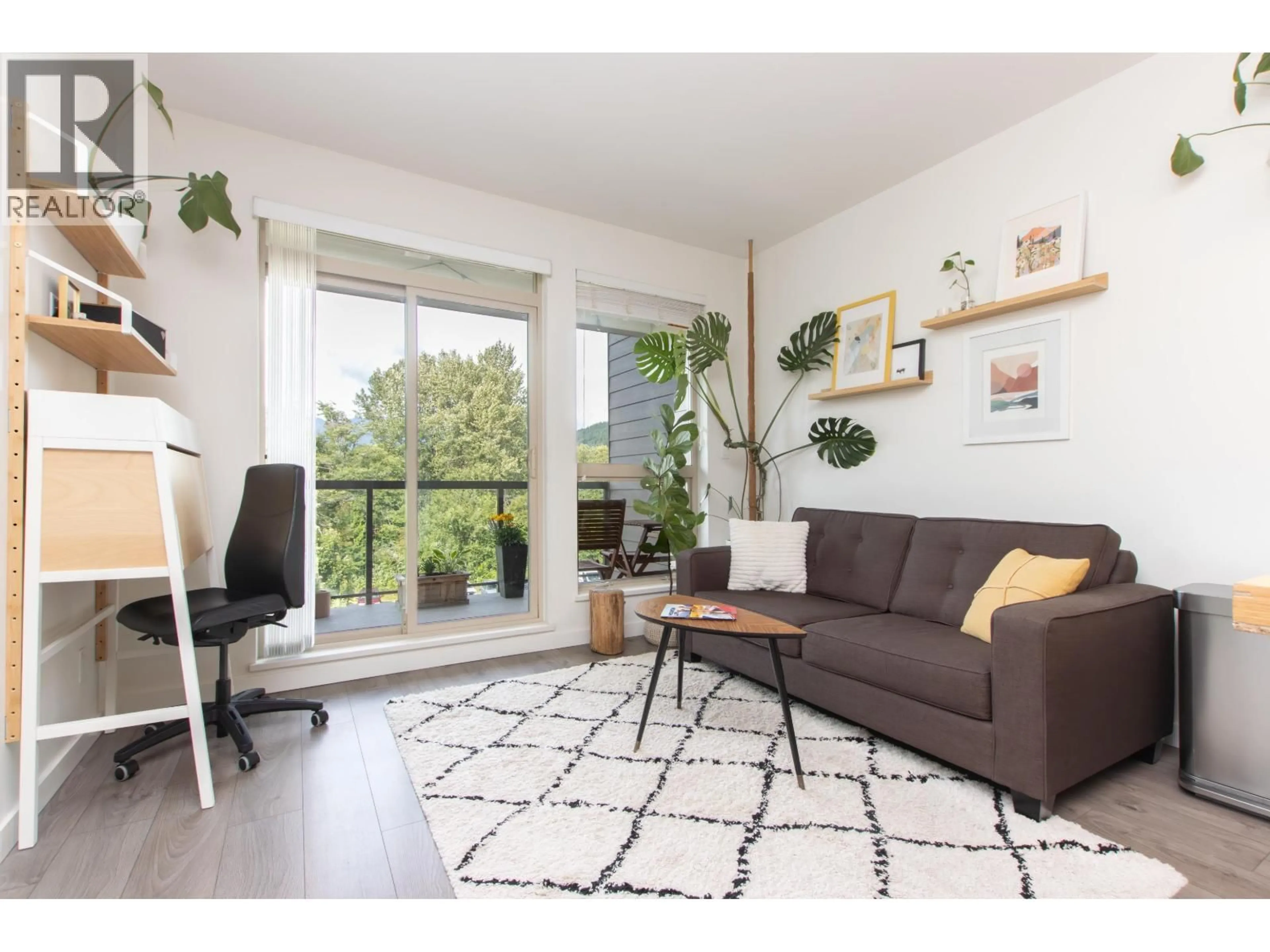 Living room with furniture, wood/laminate floor for 407 - 1150 BAILEY STREET, Squamish British Columbia V8B0R4