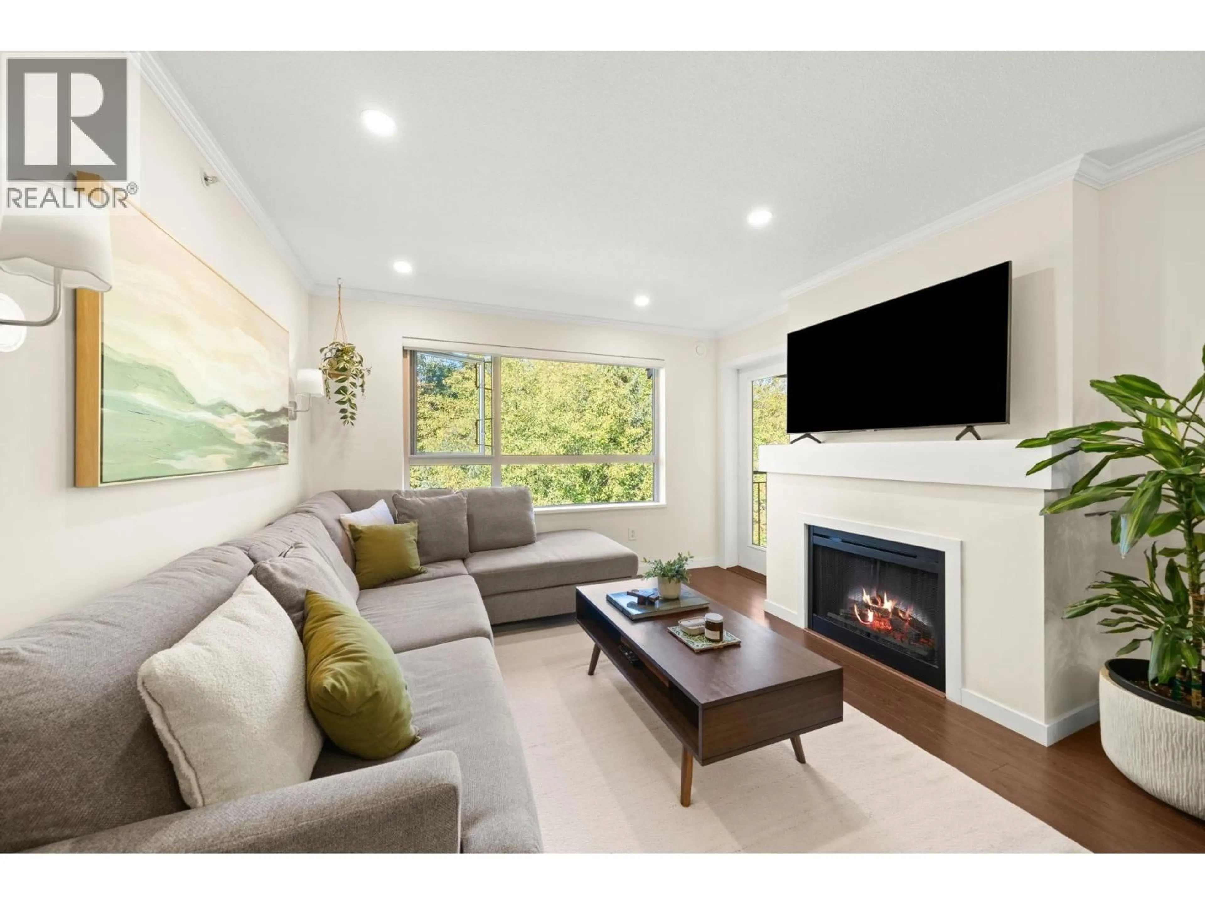 Living room with furniture, wood/laminate floor for 419 - 700 KLAHANIE DRIVE, Port Moody British Columbia V3H5L3