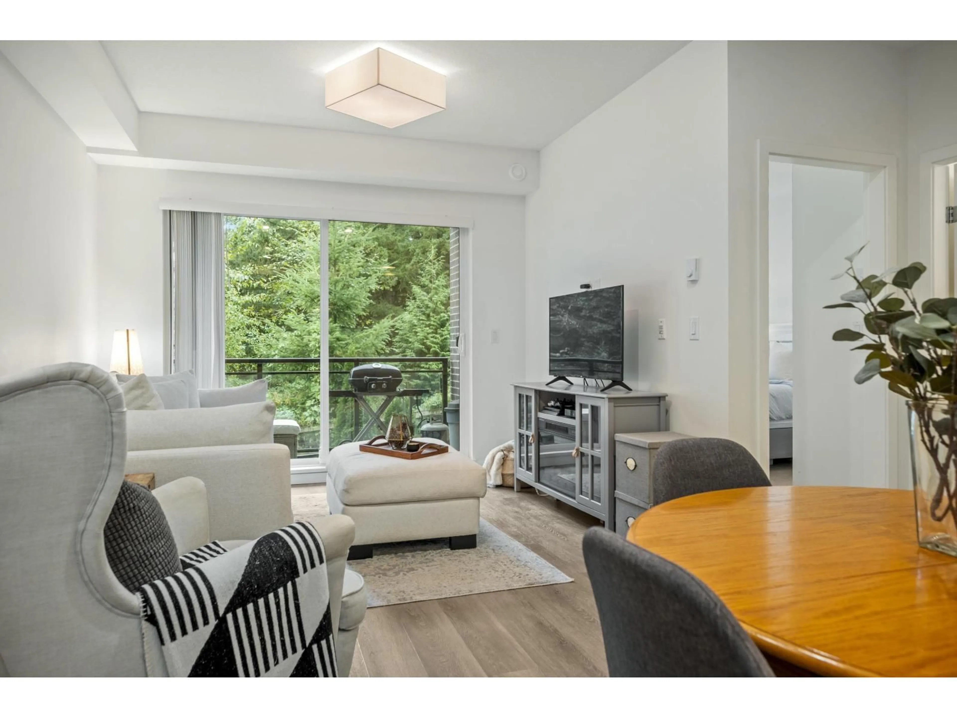 Living room with furniture, wood/laminate floor for B107 - 20087 68TH, Langley British Columbia V2Y0Y3