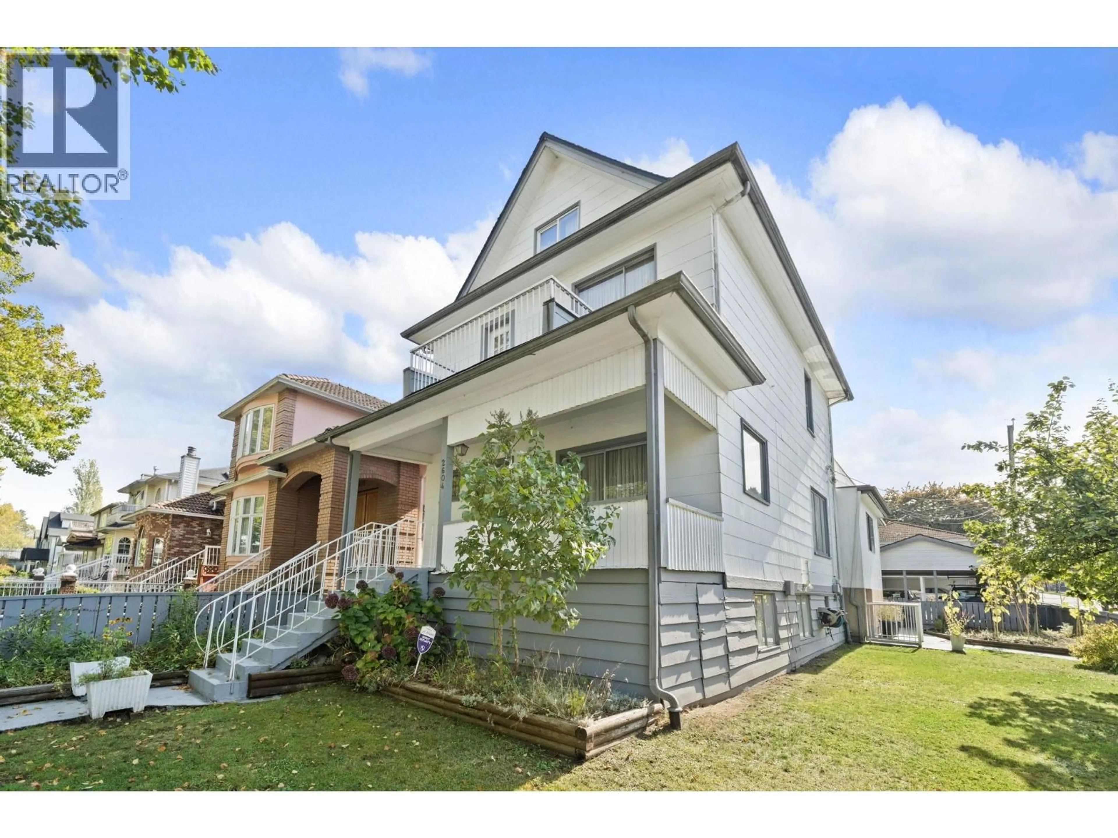Home with vinyl exterior material, street for 2604 19TH AVENUE, Vancouver British Columbia V5M2S4