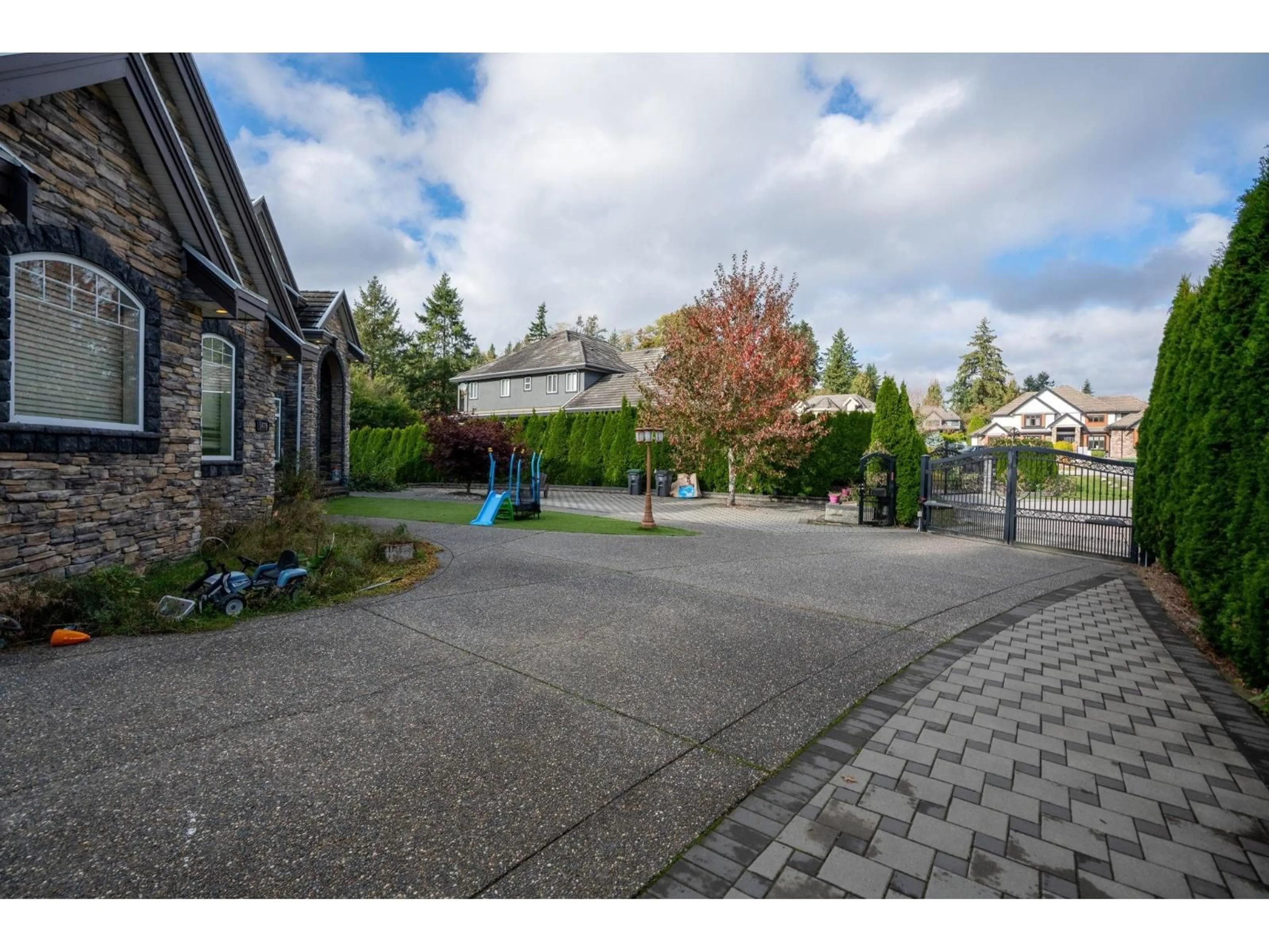 A pic from outside/outdoor area/front of a property/back of a property/a pic from drone, street for 5479 124B, Surrey British Columbia V3X3T1