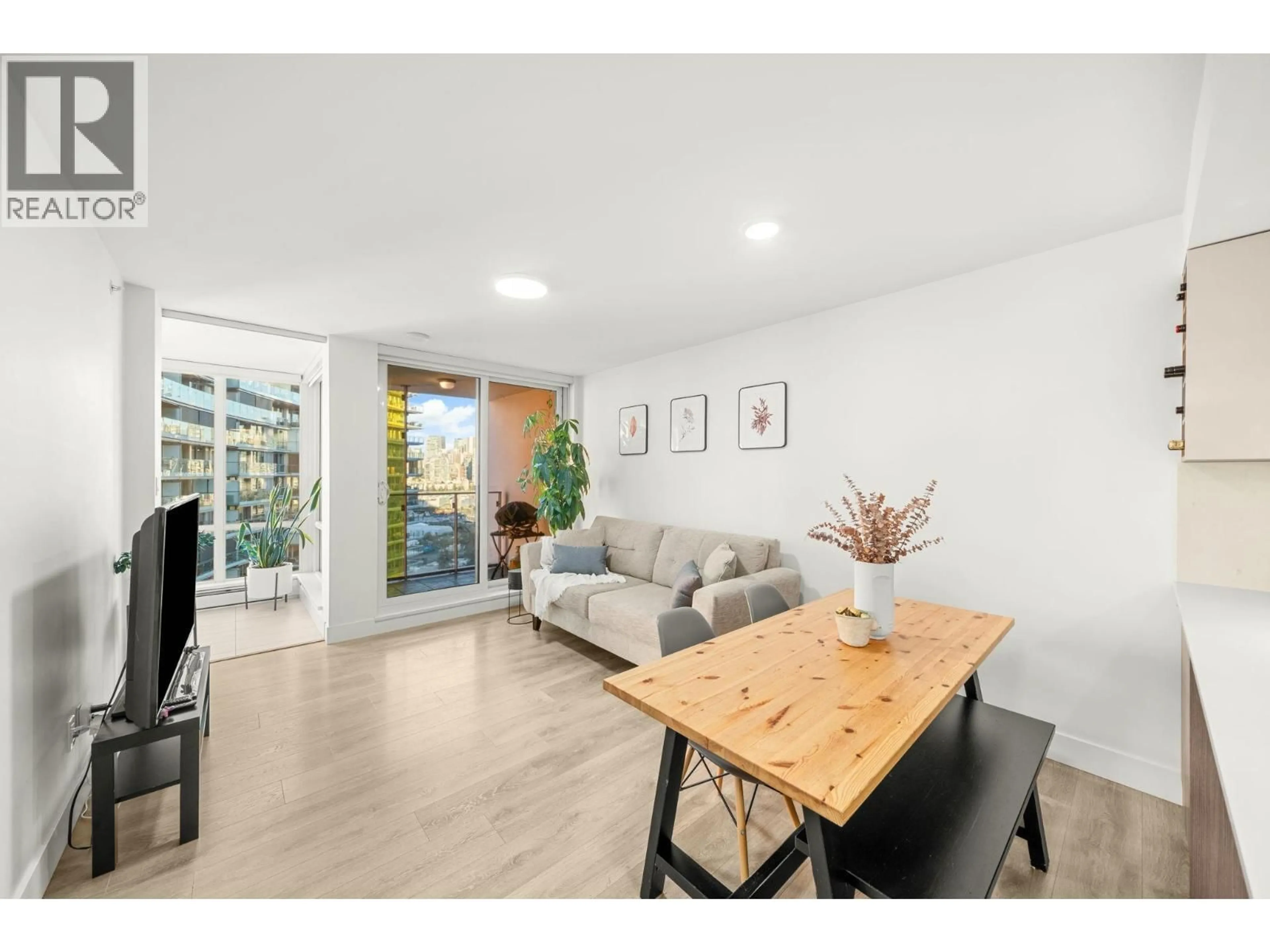Living room with furniture, wood/laminate floor for 1201 - 1788 COLUMBIA STREET, Vancouver British Columbia V5Y0L7