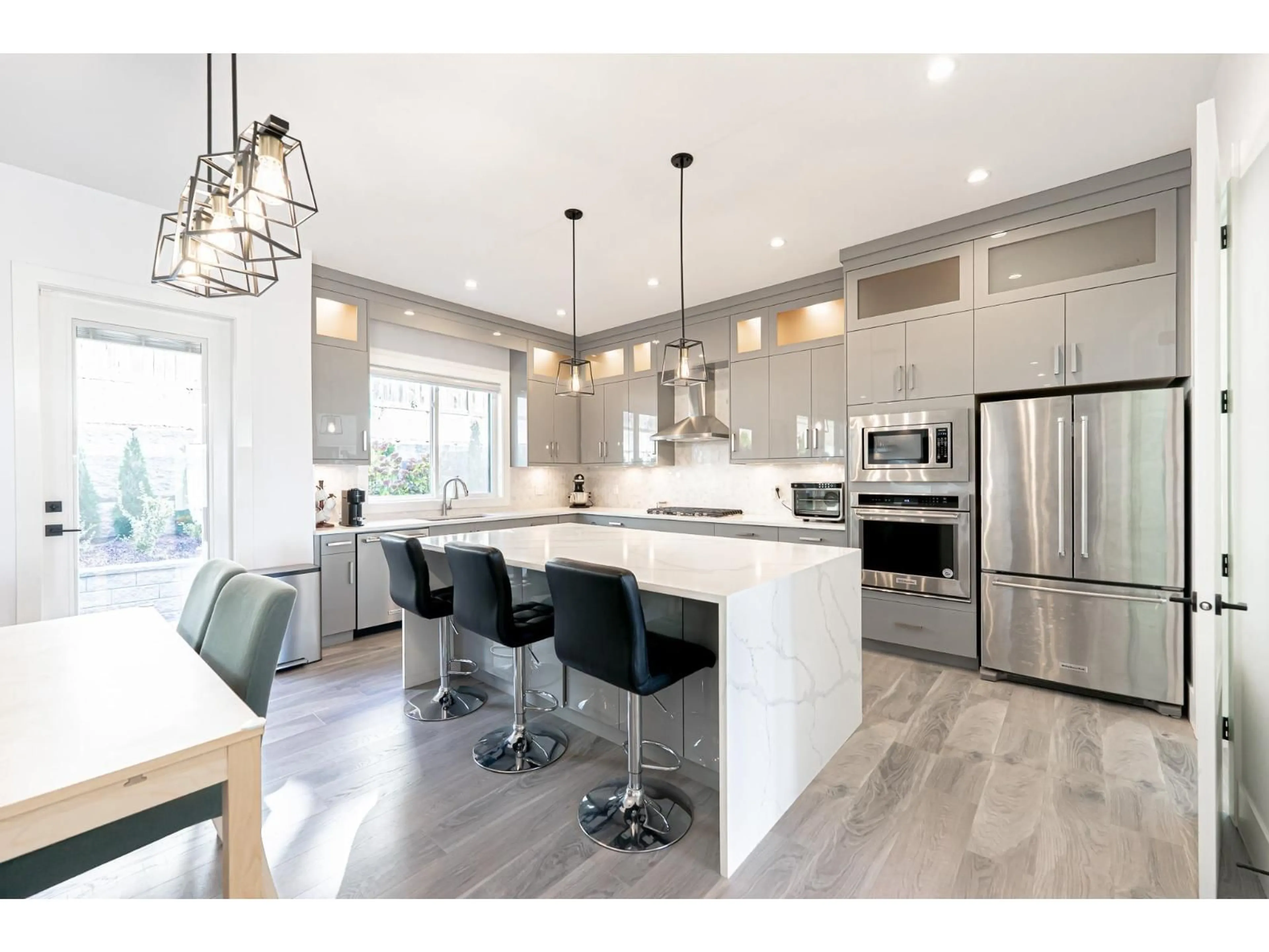 Open concept kitchen, wood/laminate floor for 16755 16A, Surrey British Columbia V3Z0B4
