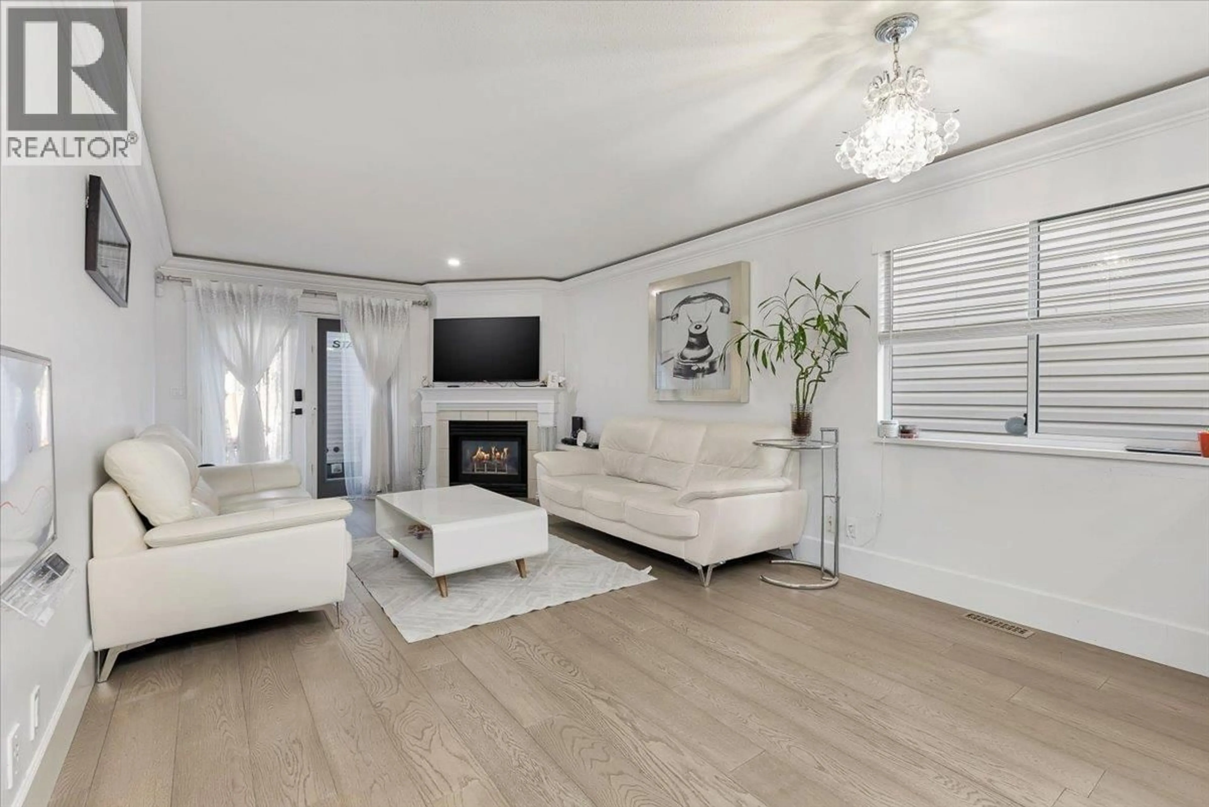 Living room with furniture, wood/laminate floor for 2470 COAST MERIDIAN ROAD, Port Coquitlam British Columbia V3B3M3