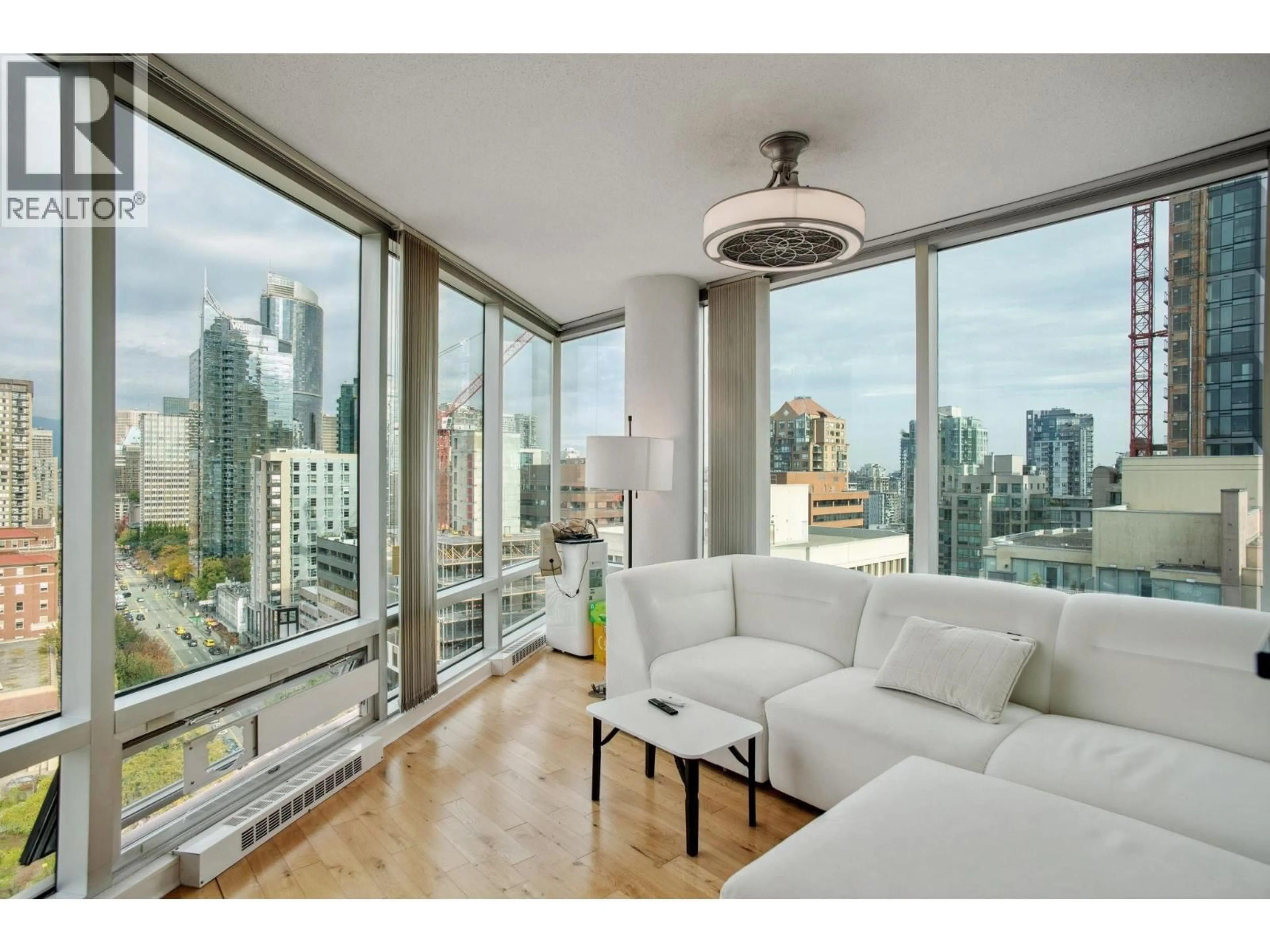 Living room with furniture, wood/laminate floor for 1702 - 1003 BURNABY STREET, Vancouver British Columbia V6E4R7