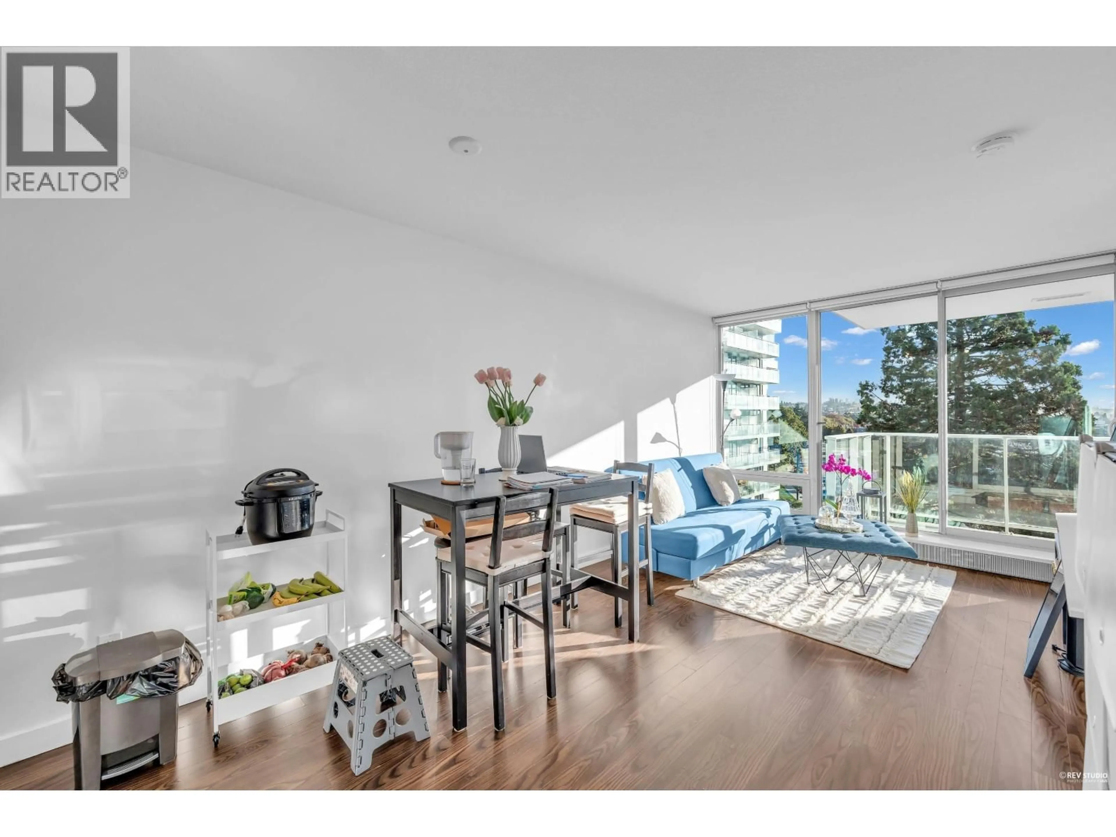 Living room with furniture, wood/laminate floor for 504 - 8131 NUNAVUT LANE, Vancouver British Columbia V5X0E2