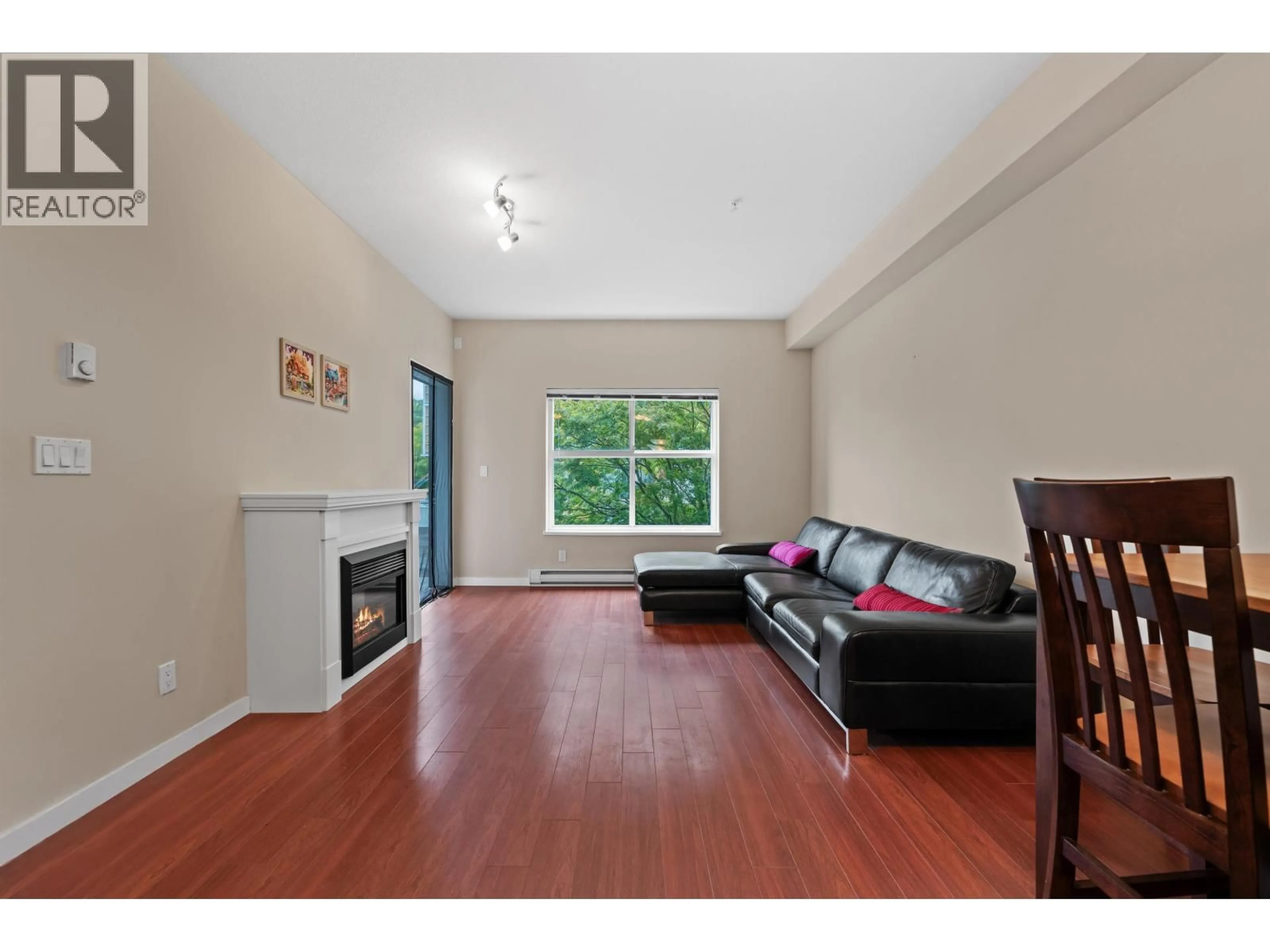 Living room with furniture, wood/laminate floor for 204 - 2488 KELLY AVENUE, Port Coquitlam British Columbia V3C1Y4