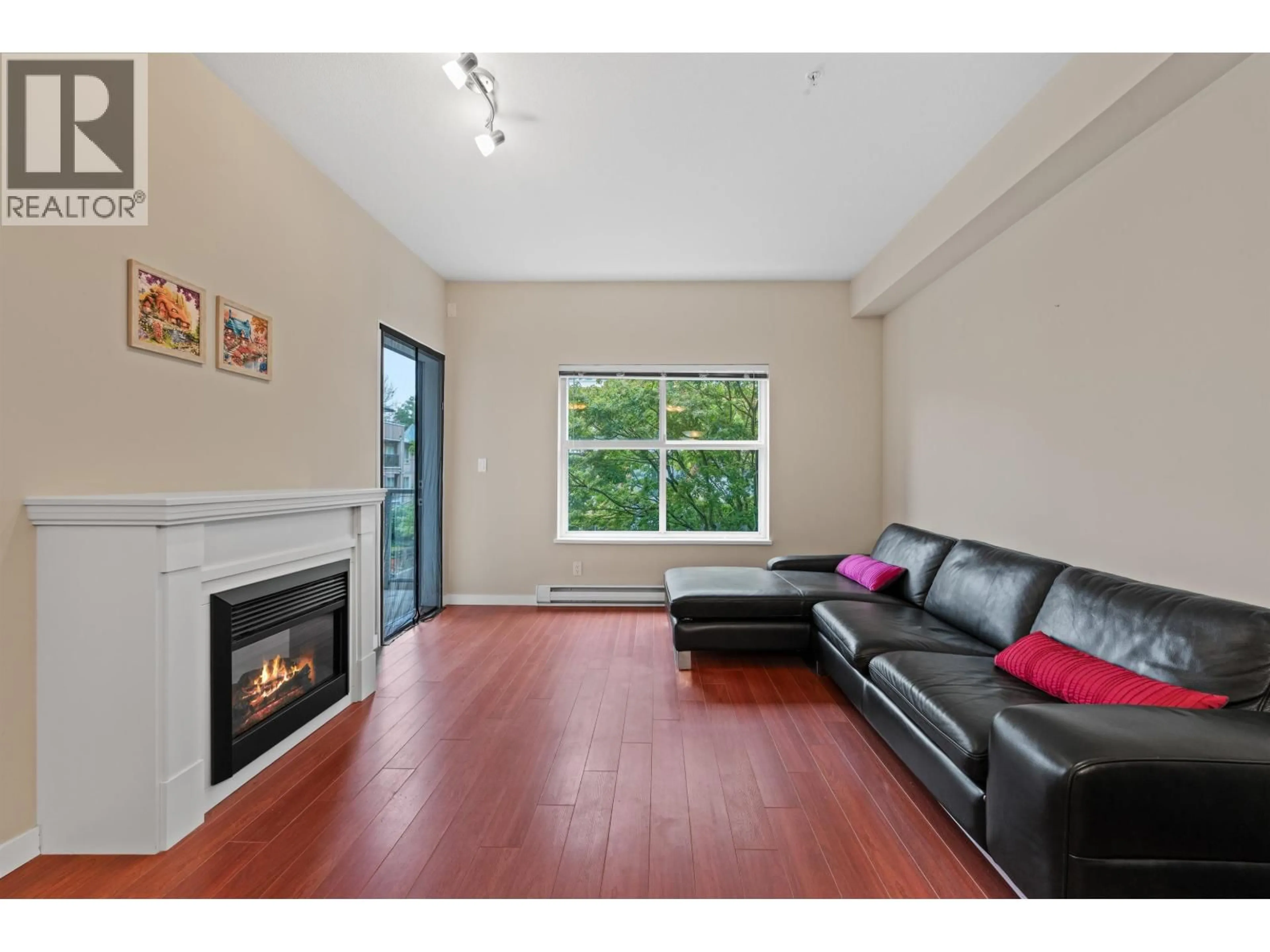 Living room with furniture, wood/laminate floor for 204 - 2488 KELLY AVENUE, Port Coquitlam British Columbia V3C1Y4