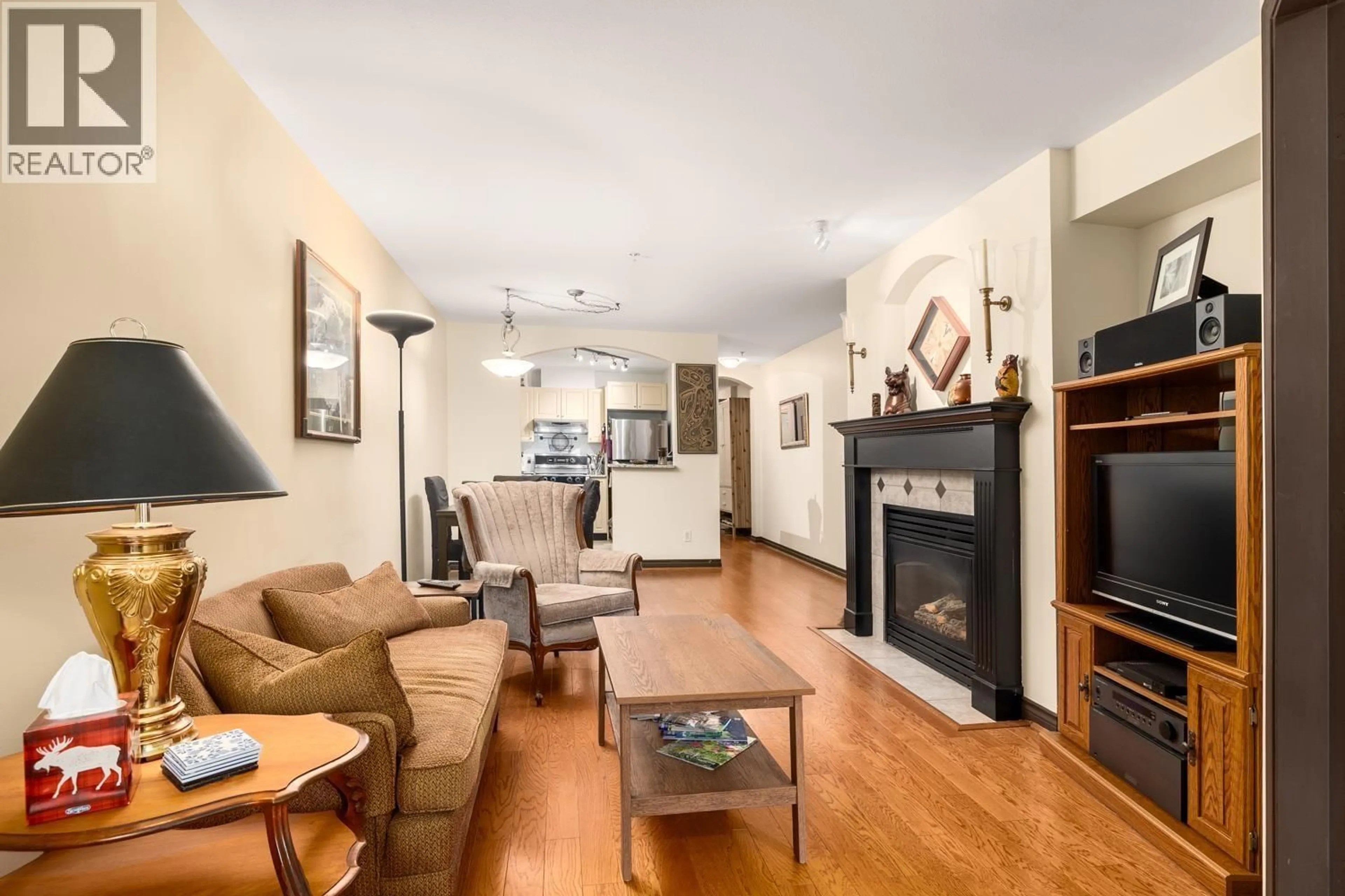 Living room with furniture, wood/laminate floor for 206 - 5723 COLLINGWOOD STREET, Vancouver British Columbia V6N4K6