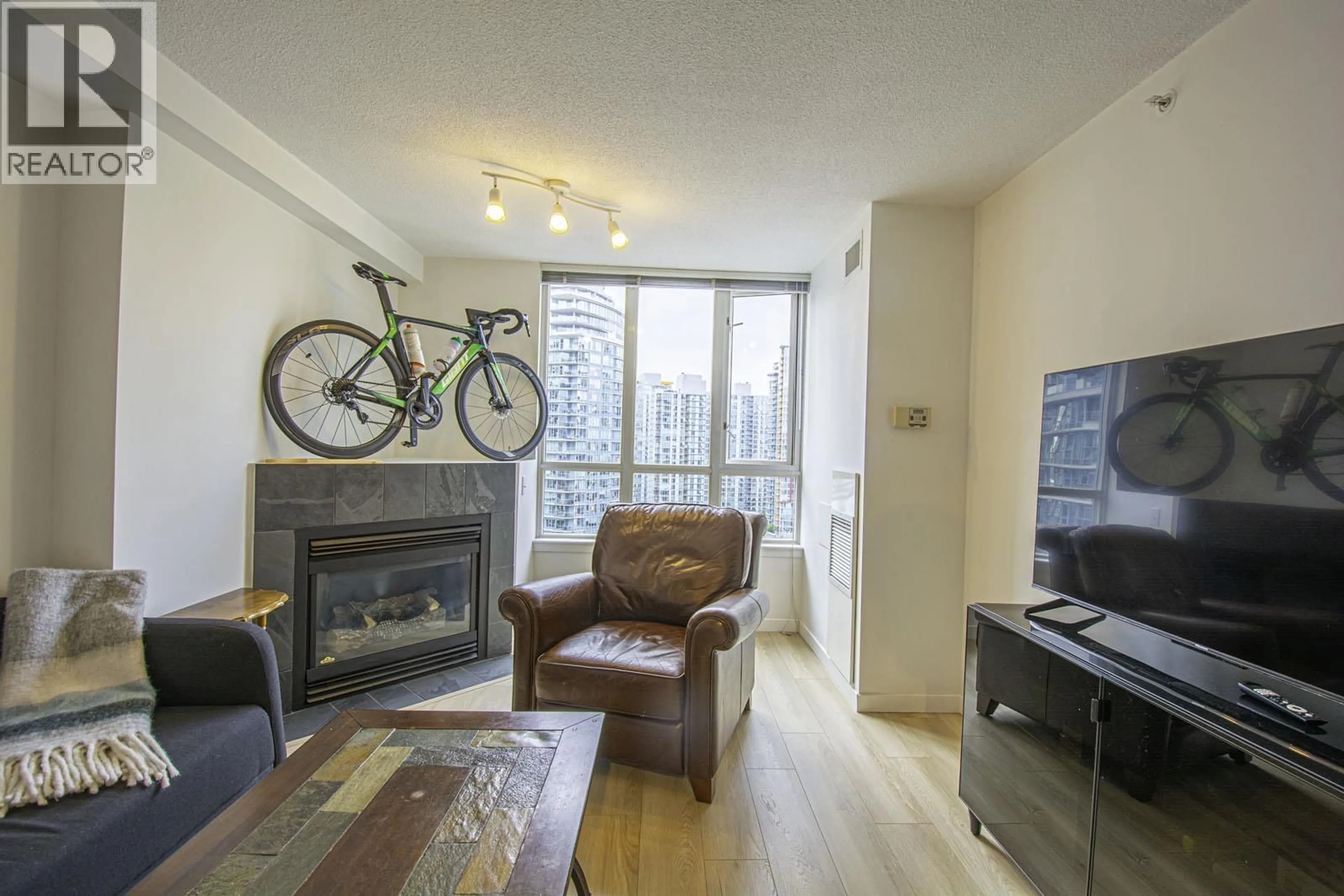 Living room with furniture, wood/laminate floor for 2510 - 63 KEEFER PLACE, Vancouver British Columbia V6B6N6