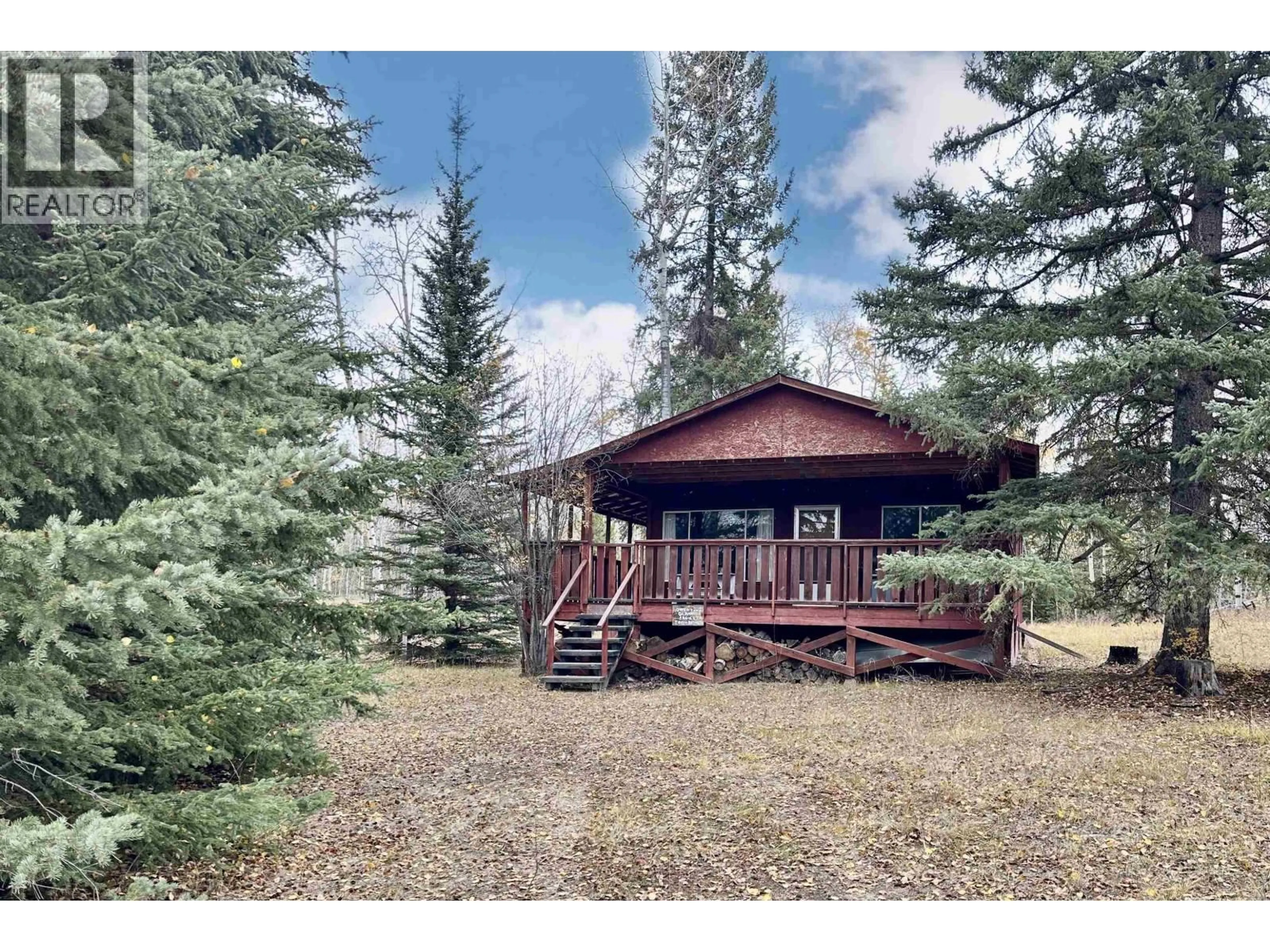 A pic from outside/outdoor area/front of a property/back of a property/a pic from drone, forest/trees view for 6391 FOX CRESCENT, 70 Mile House British Columbia V0K2K1