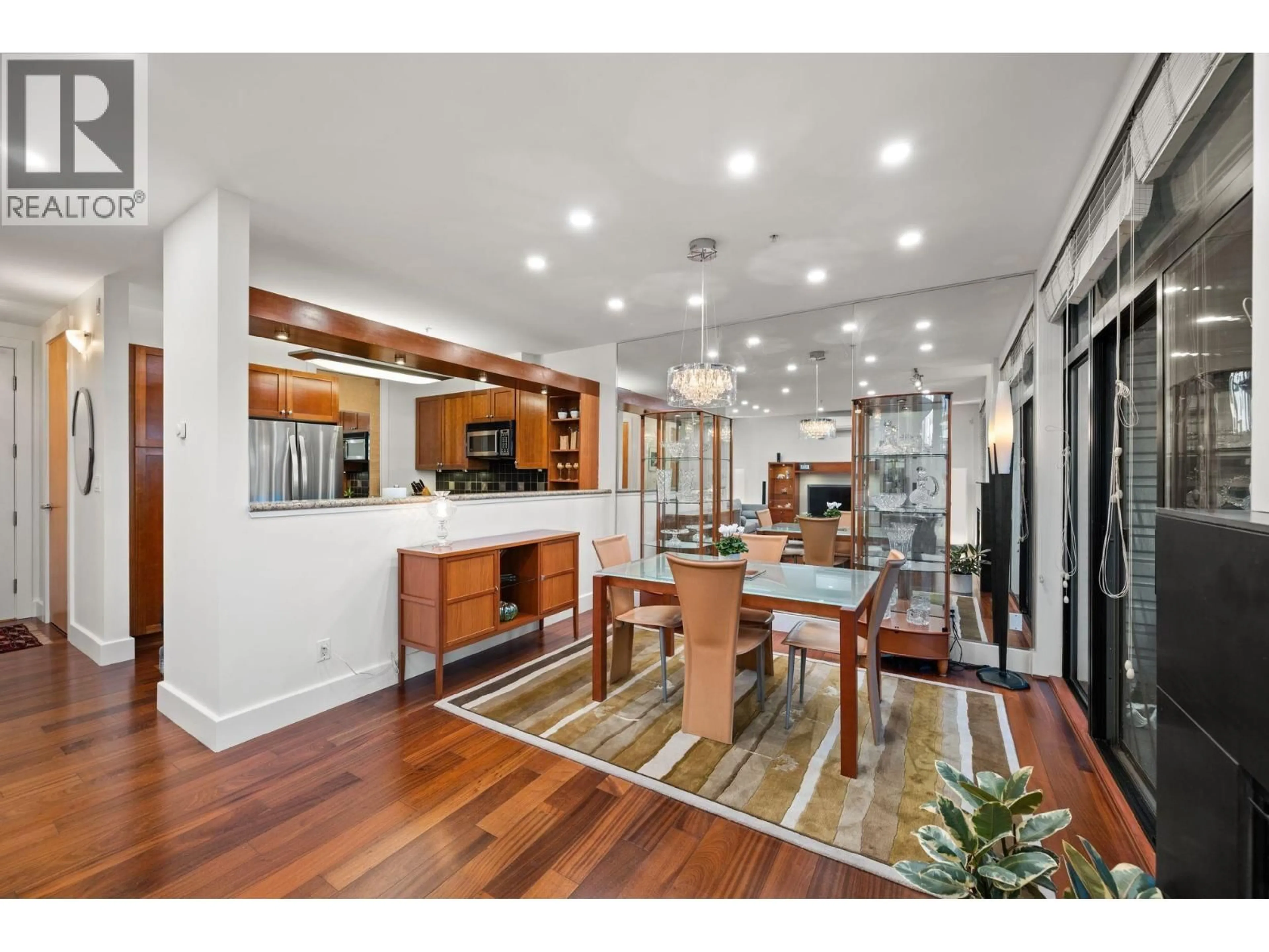 Open concept kitchen, wood/laminate floor for 202 - 1750 2ND AVENUE, Vancouver British Columbia V6J1H6