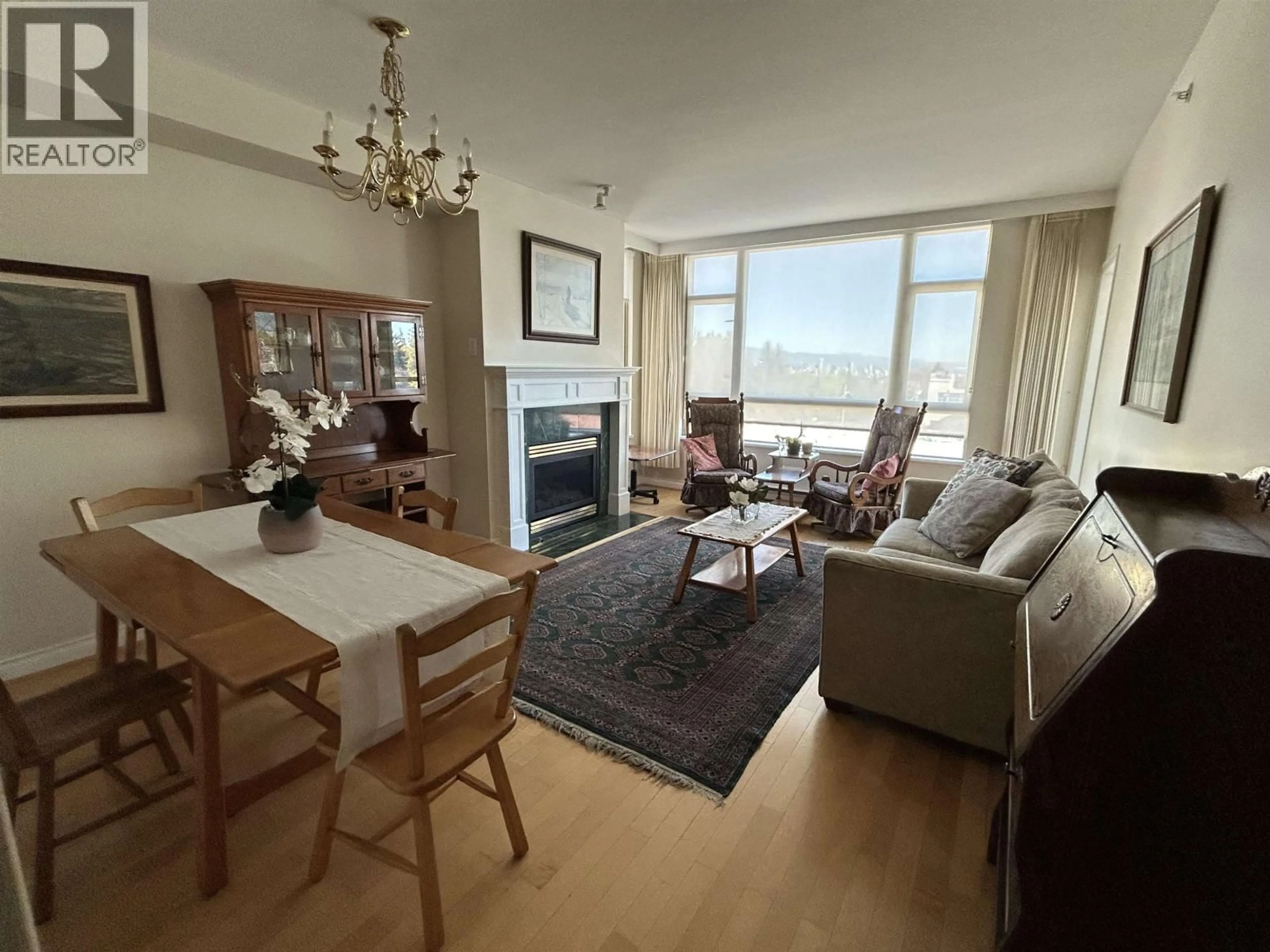 Living room with furniture, wood/laminate floor for 403 - 2580 TOLMIE STREET, Vancouver British Columbia V6R4R4