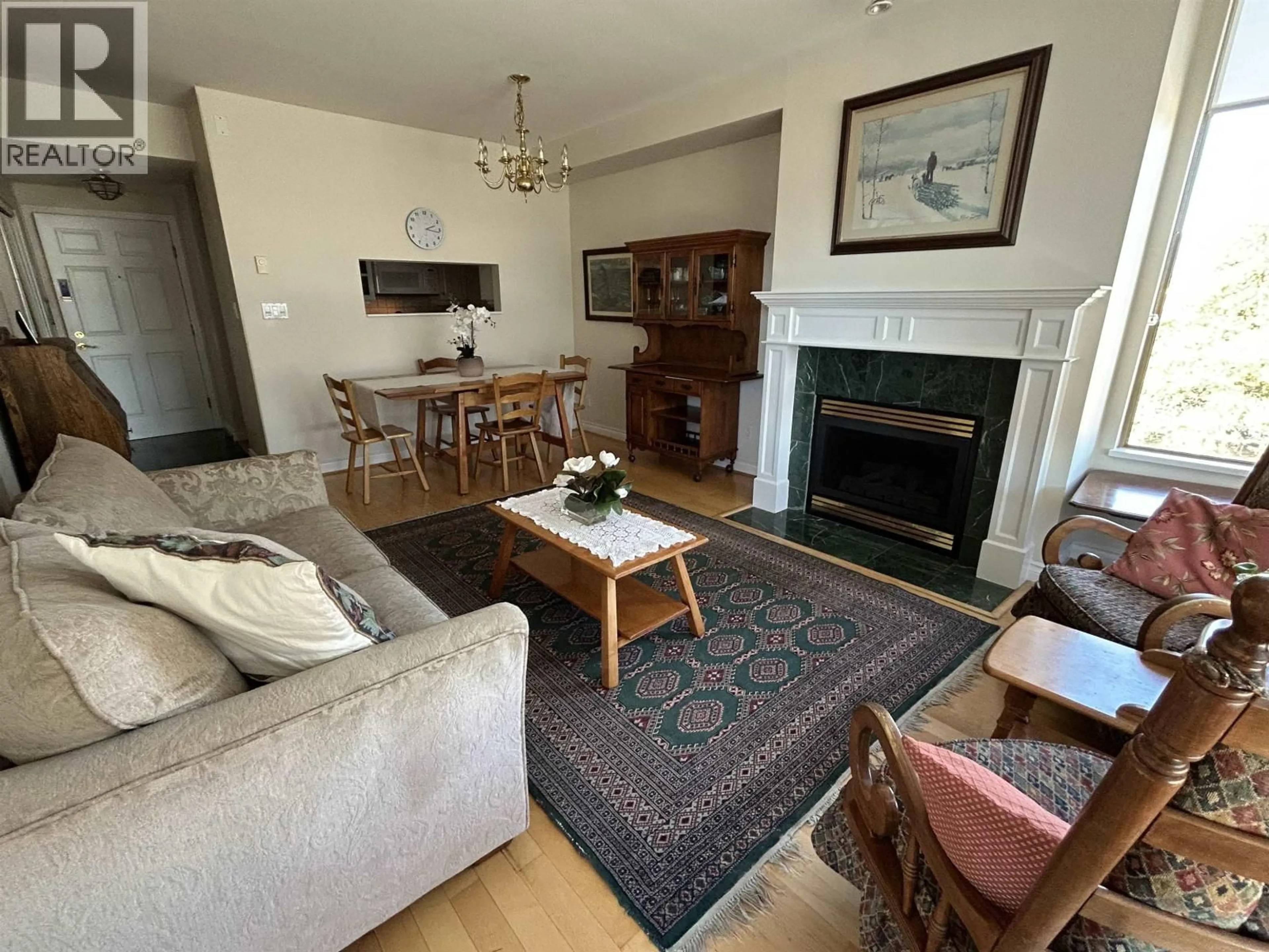 Living room with furniture, wood/laminate floor for 403 - 2580 TOLMIE STREET, Vancouver British Columbia V6R4R4
