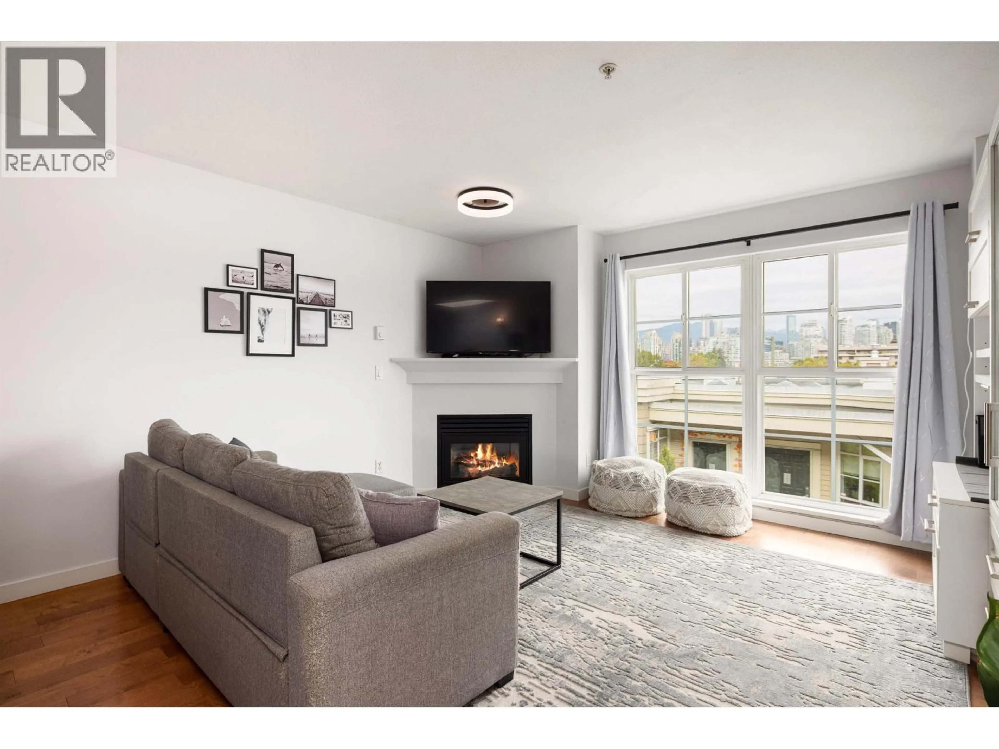 Living room with furniture, wood/laminate floor for 317 - 678 7TH AVENUE, Vancouver British Columbia V5Z1B5