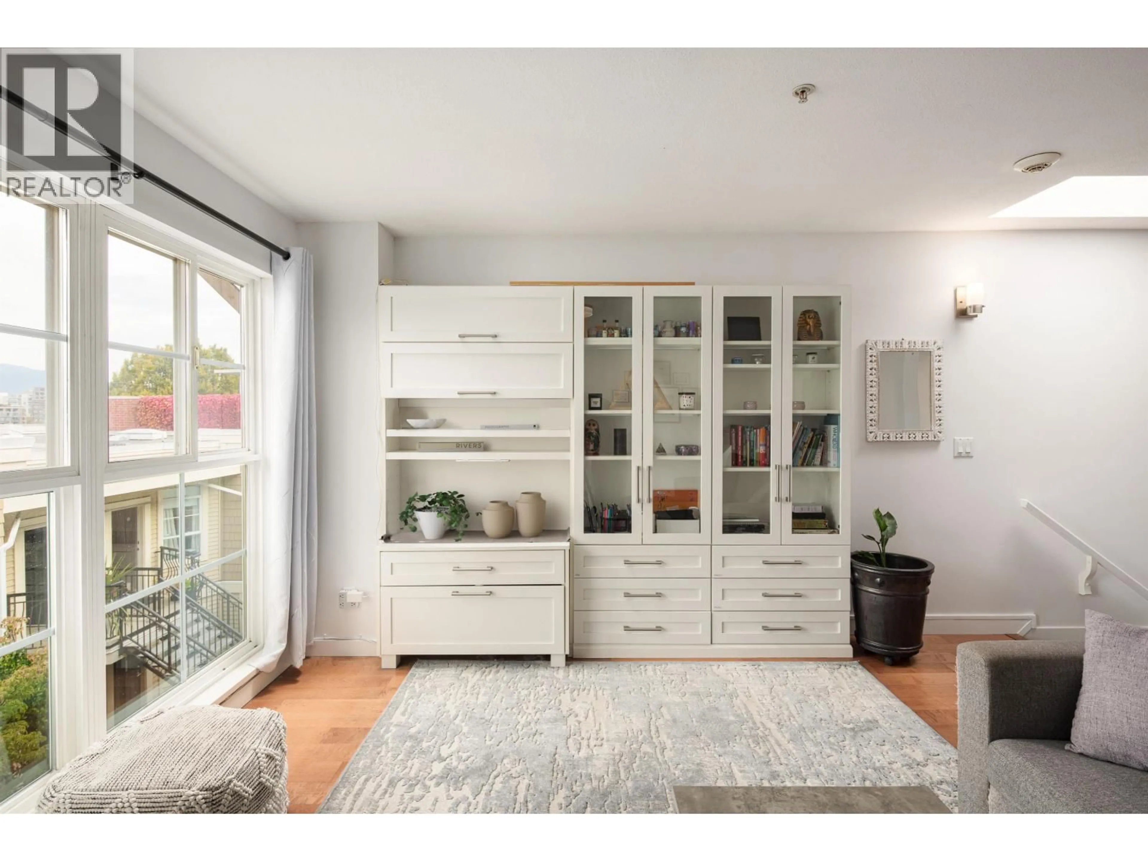 Living room with furniture, wood/laminate floor for 317 - 678 7TH AVENUE, Vancouver British Columbia V5Z1B5