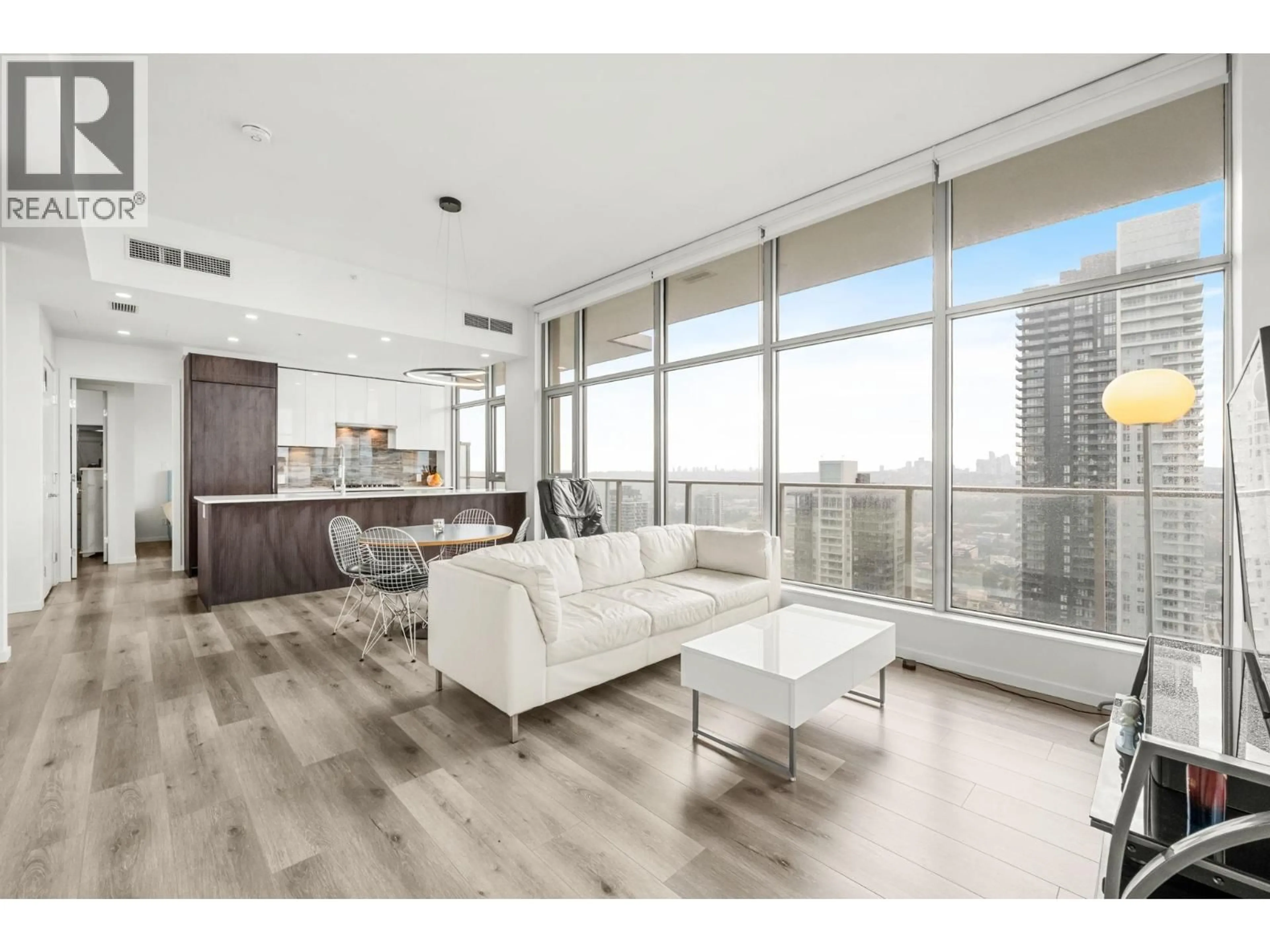 Living room with furniture, wood/laminate floor for 4602 - 1888 GILMORE AVENUE, Burnaby British Columbia V5C0L2