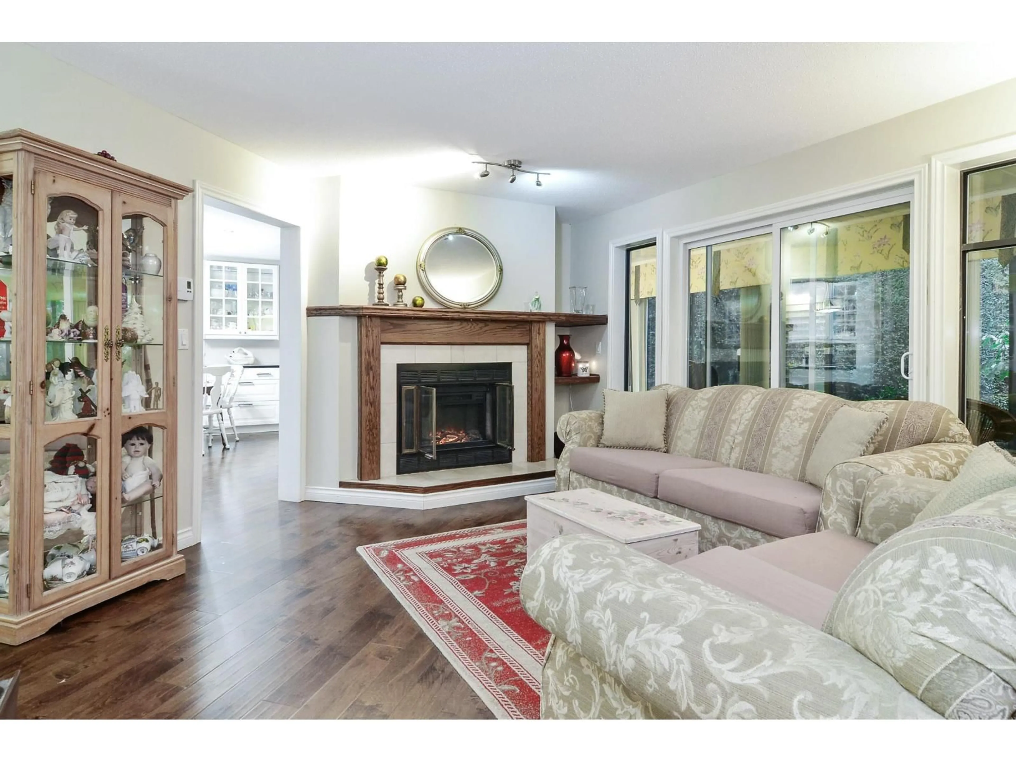Living room with furniture, wood/laminate floor for 105 - 13894 102, Surrey British Columbia V3T1P1