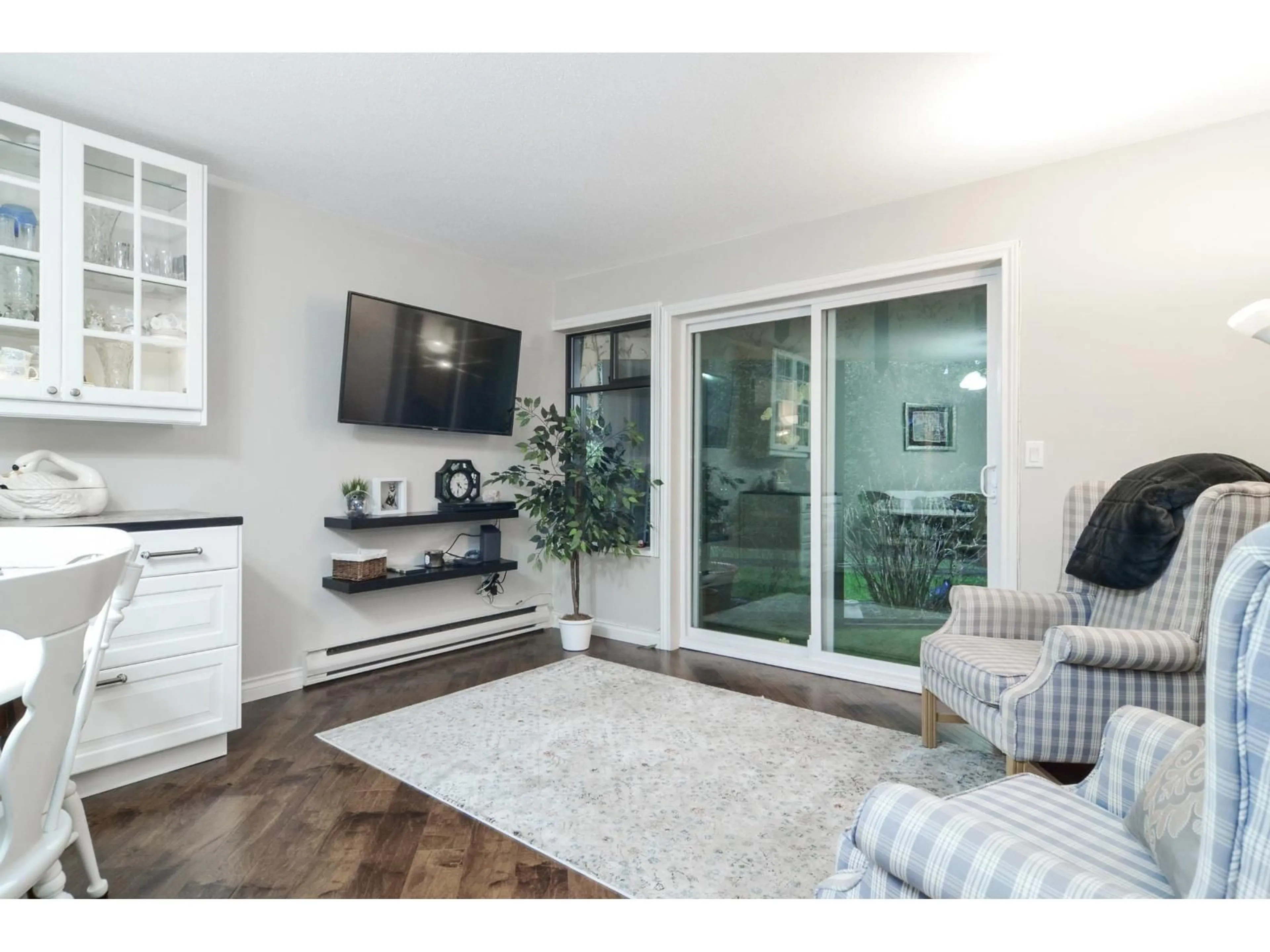 Living room with furniture, wood/laminate floor for 105 - 13894 102, Surrey British Columbia V3T1P1