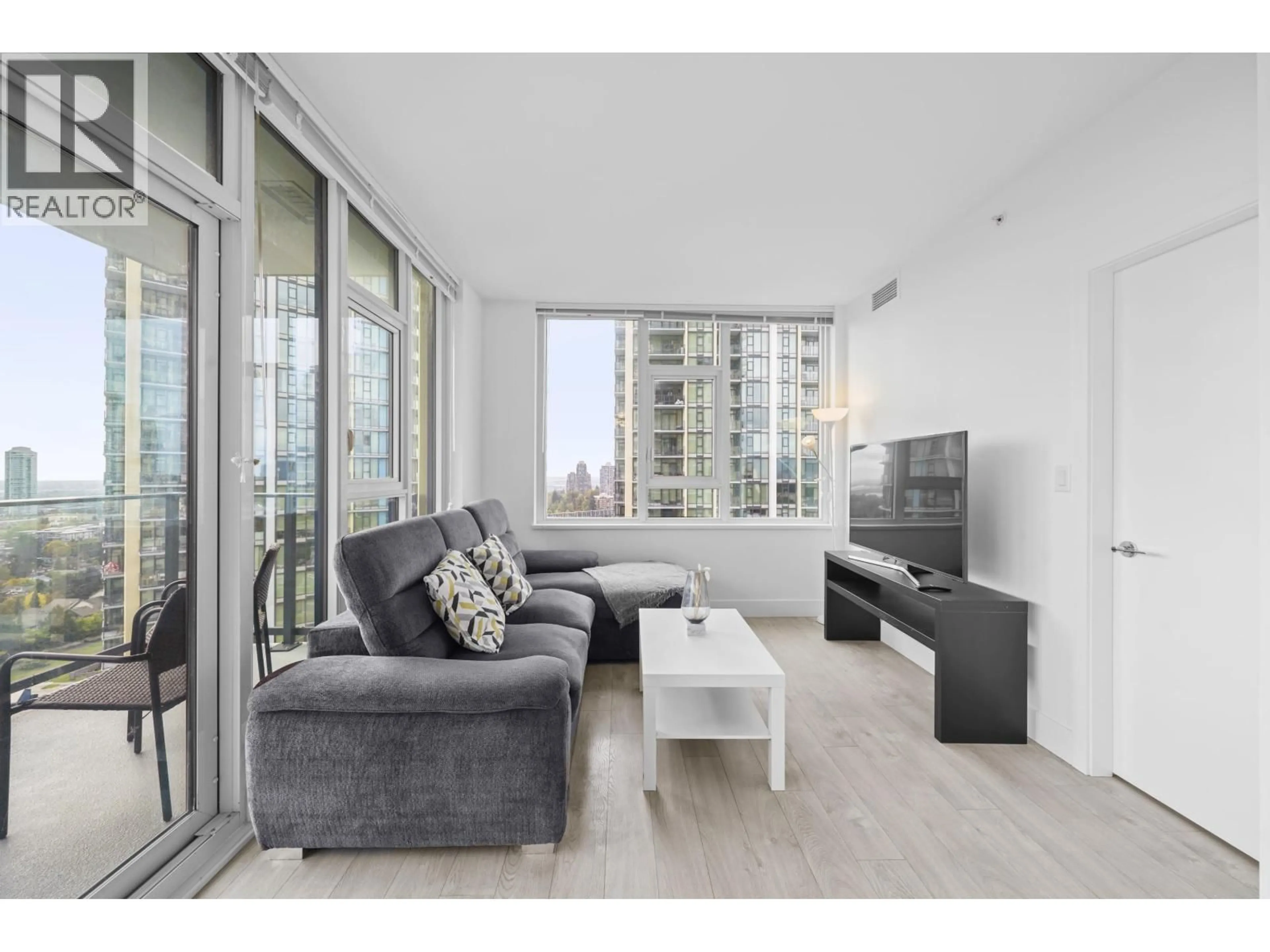 Living room with furniture, wood/laminate floor for 1610 - 7303 NOBLE LANE, Burnaby British Columbia V3N0H2