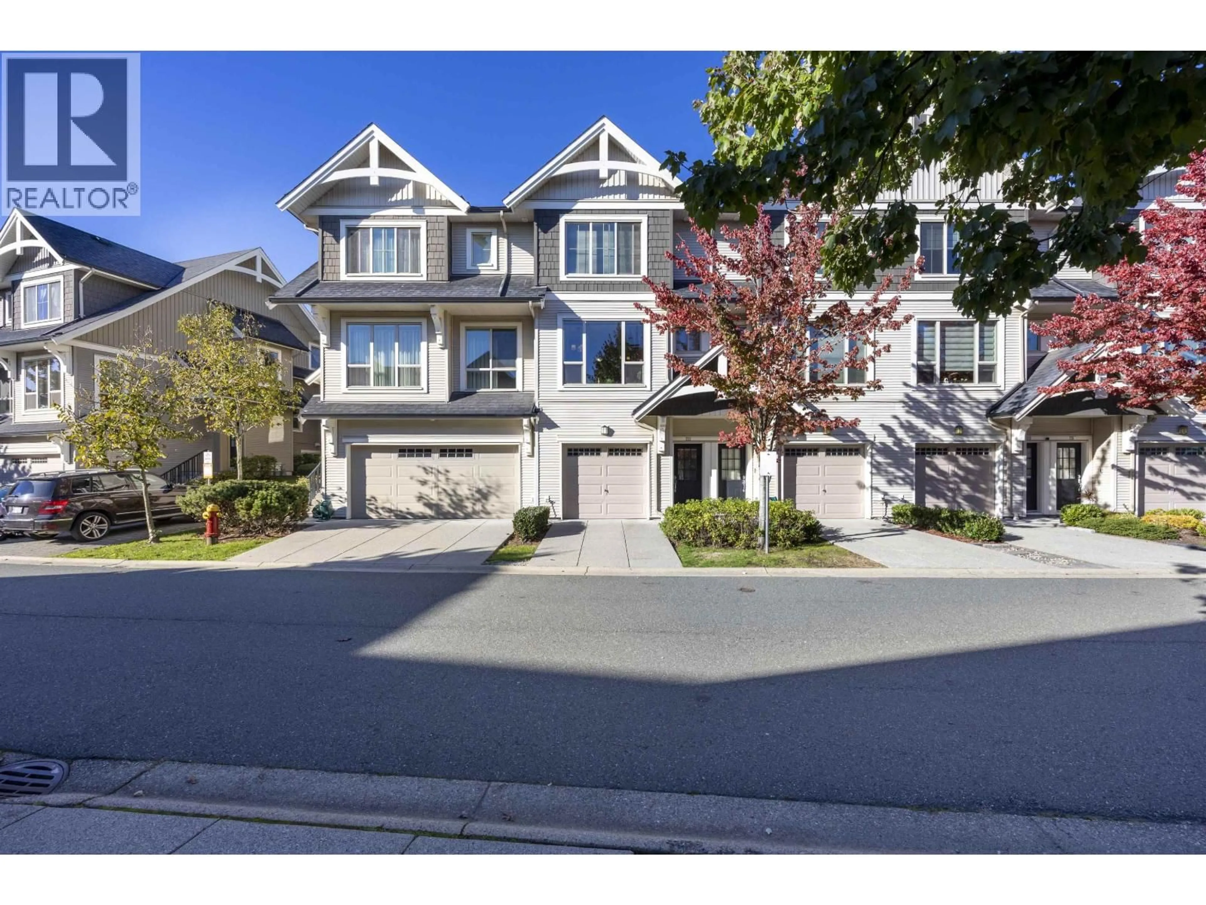 A pic from outside/outdoor area/front of a property/back of a property/a pic from drone, street for 211 - 3105 DAYANEE SPRINGS BOULEVARD, Coquitlam British Columbia V3E0C2