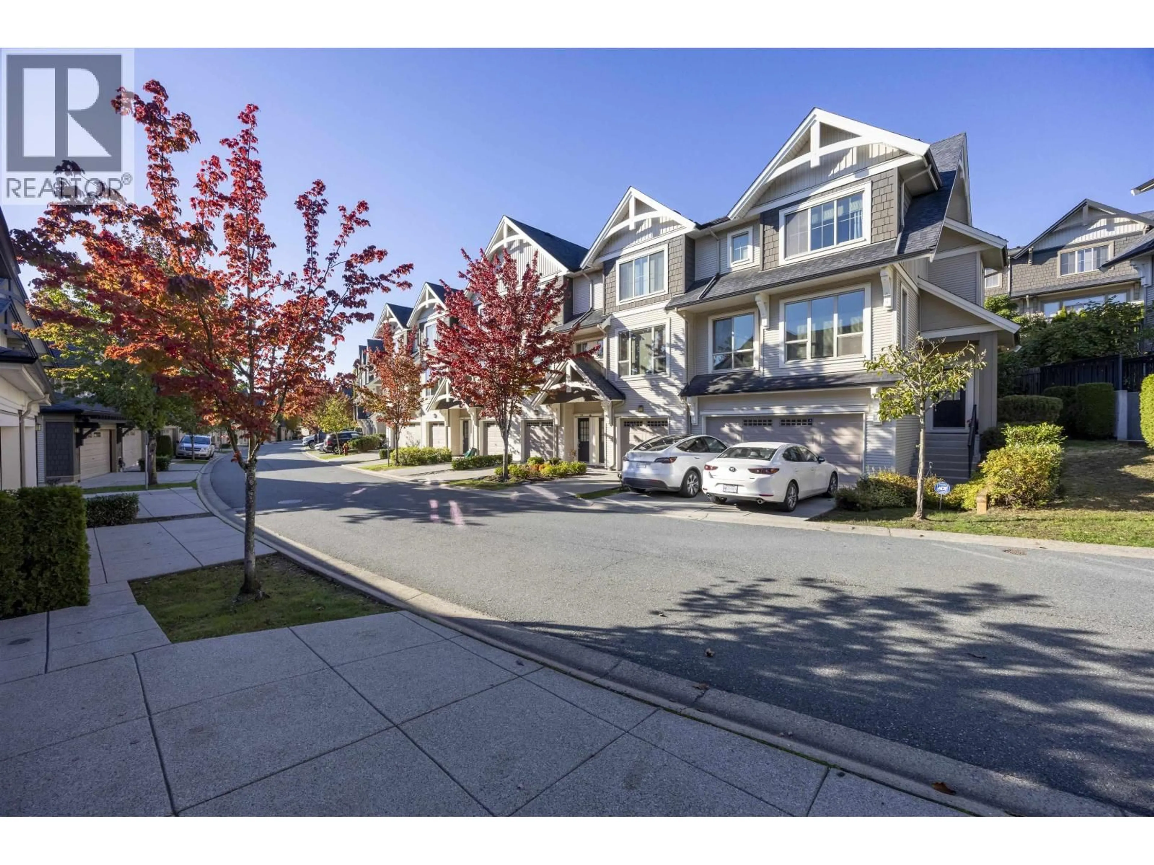 A pic from outside/outdoor area/front of a property/back of a property/a pic from drone, street for 211 - 3105 DAYANEE SPRINGS BOULEVARD, Coquitlam British Columbia V3E0C2