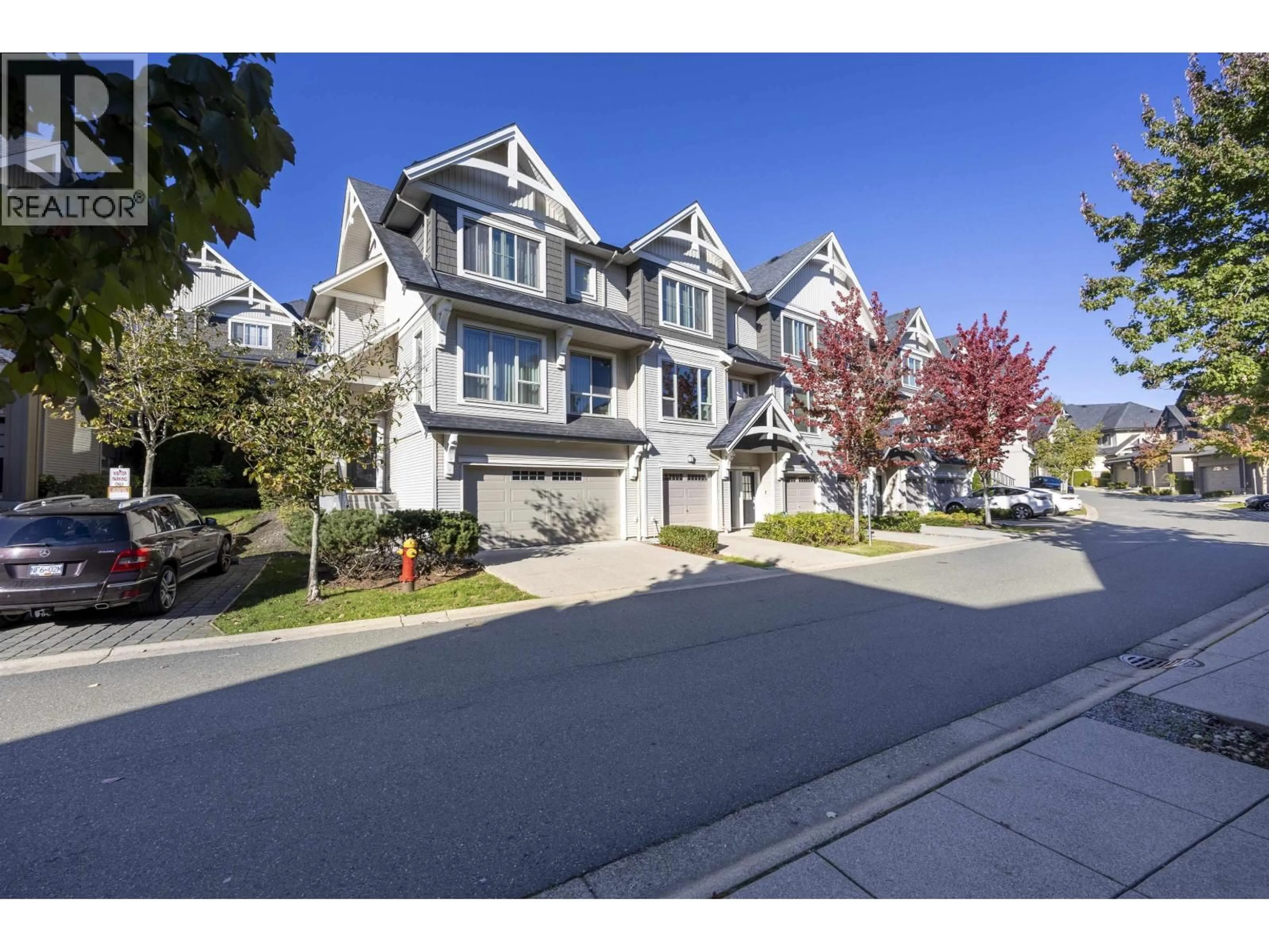 A pic from outside/outdoor area/front of a property/back of a property/a pic from drone, street for 211 - 3105 DAYANEE SPRINGS BOULEVARD, Coquitlam British Columbia V3E0C2