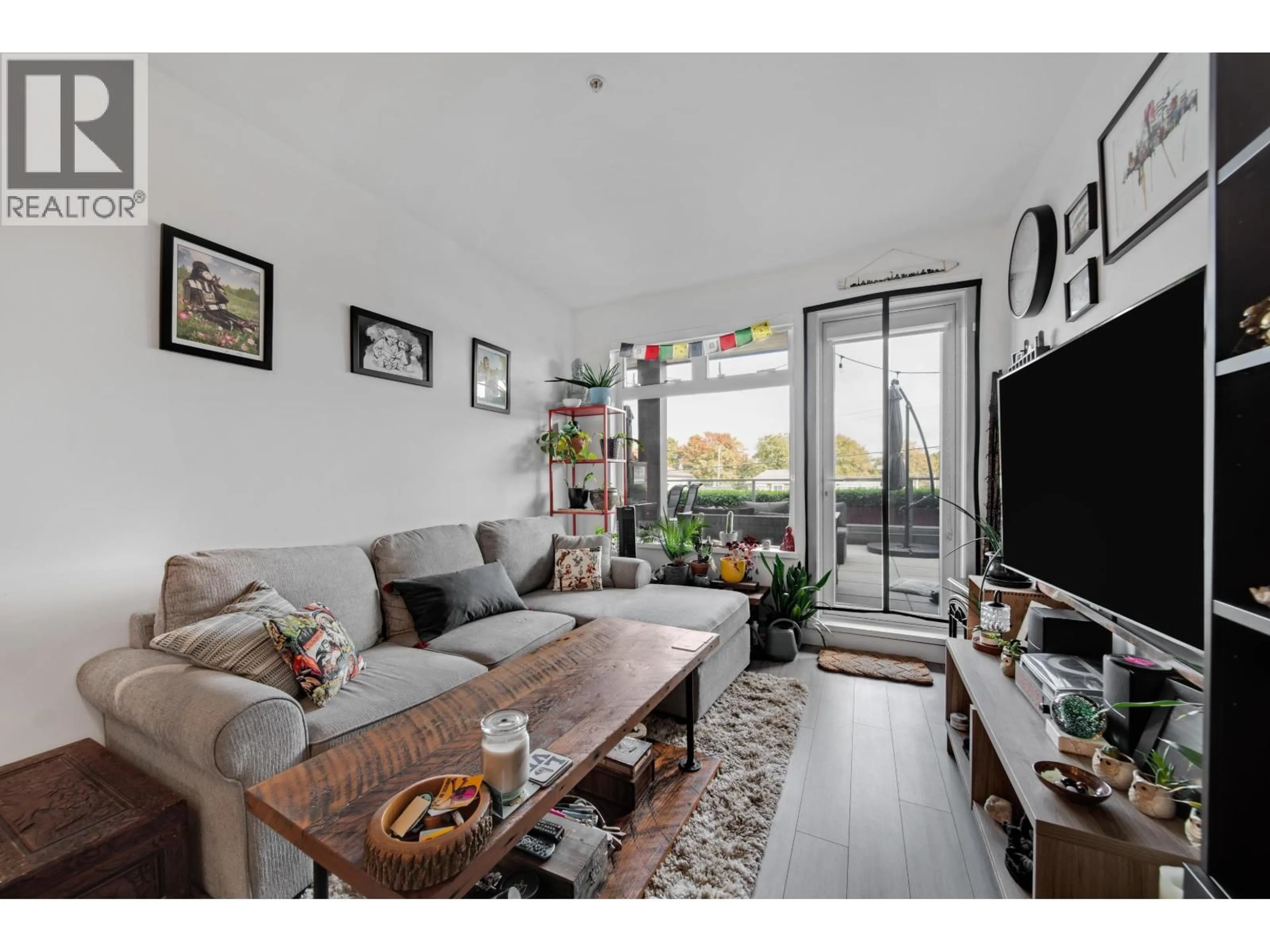 Living room with furniture, wood/laminate floor for 202 - 2408 GRANT STREET, Vancouver British Columbia V5K3G4