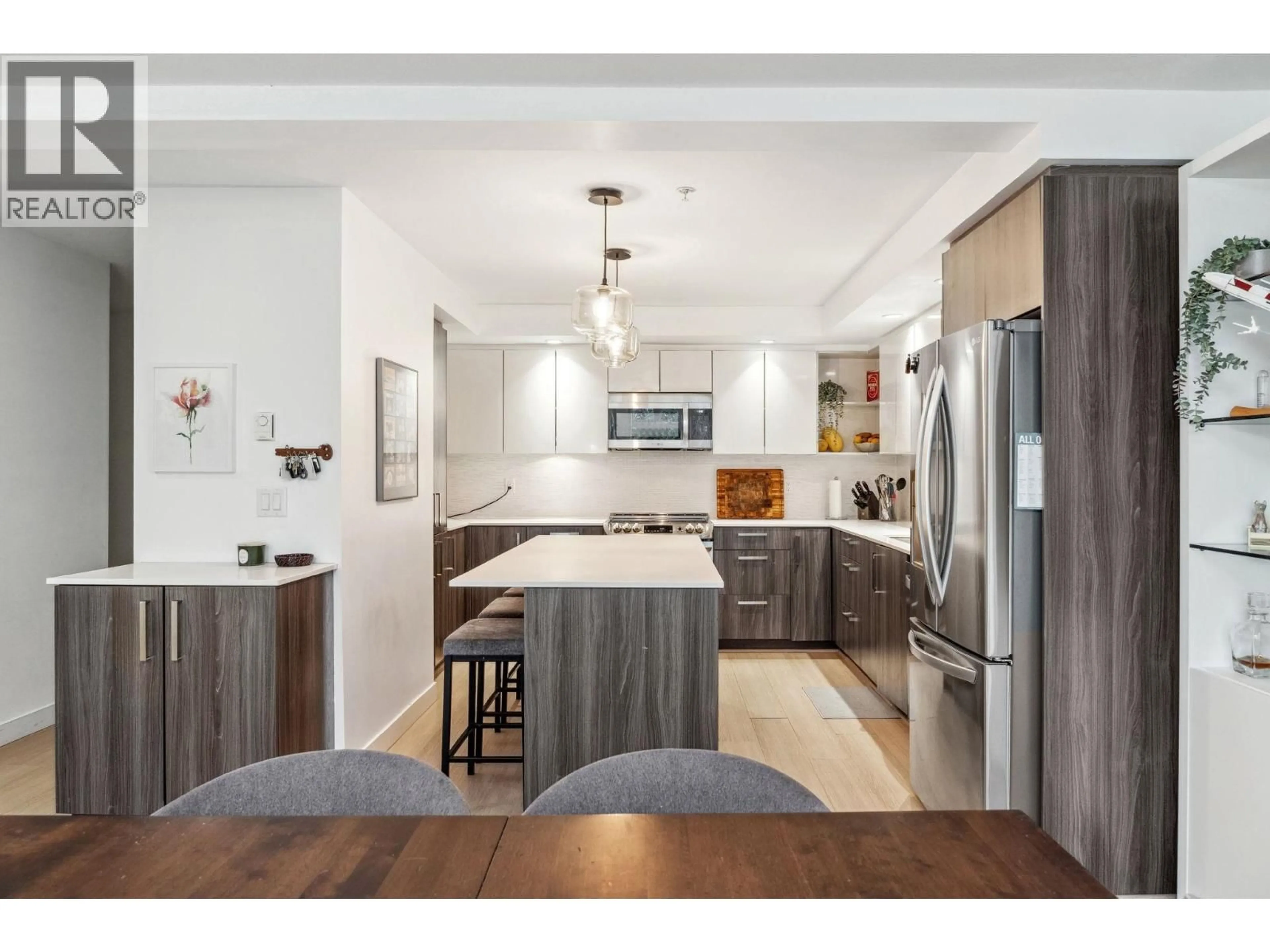 Open concept kitchen, wood/laminate floor for 501 - 160 SHORELINE CIRCLE, Port Moody British Columbia V3H0B2