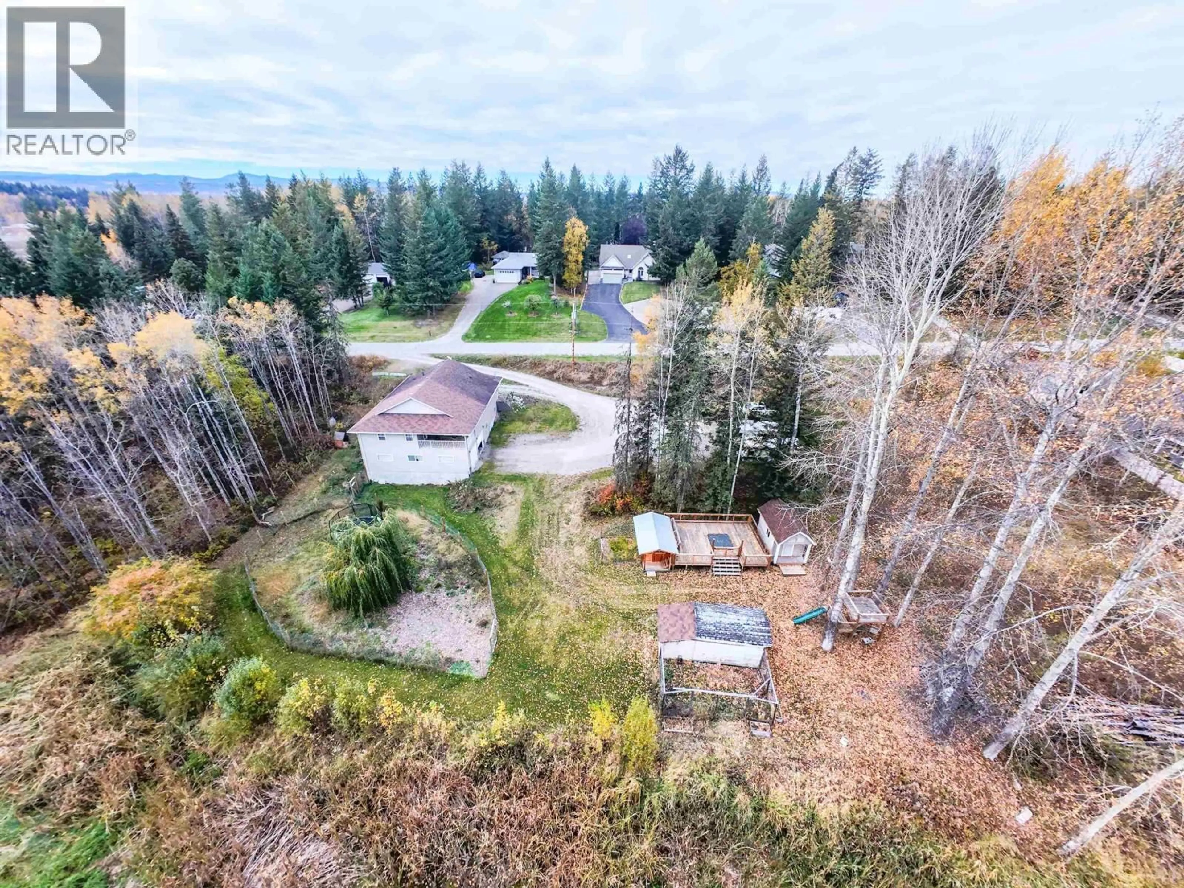 A pic from outside/outdoor area/front of a property/back of a property/a pic from drone, forest/trees view for 380 DENNIS ROAD, Quesnel British Columbia V2J5M6
