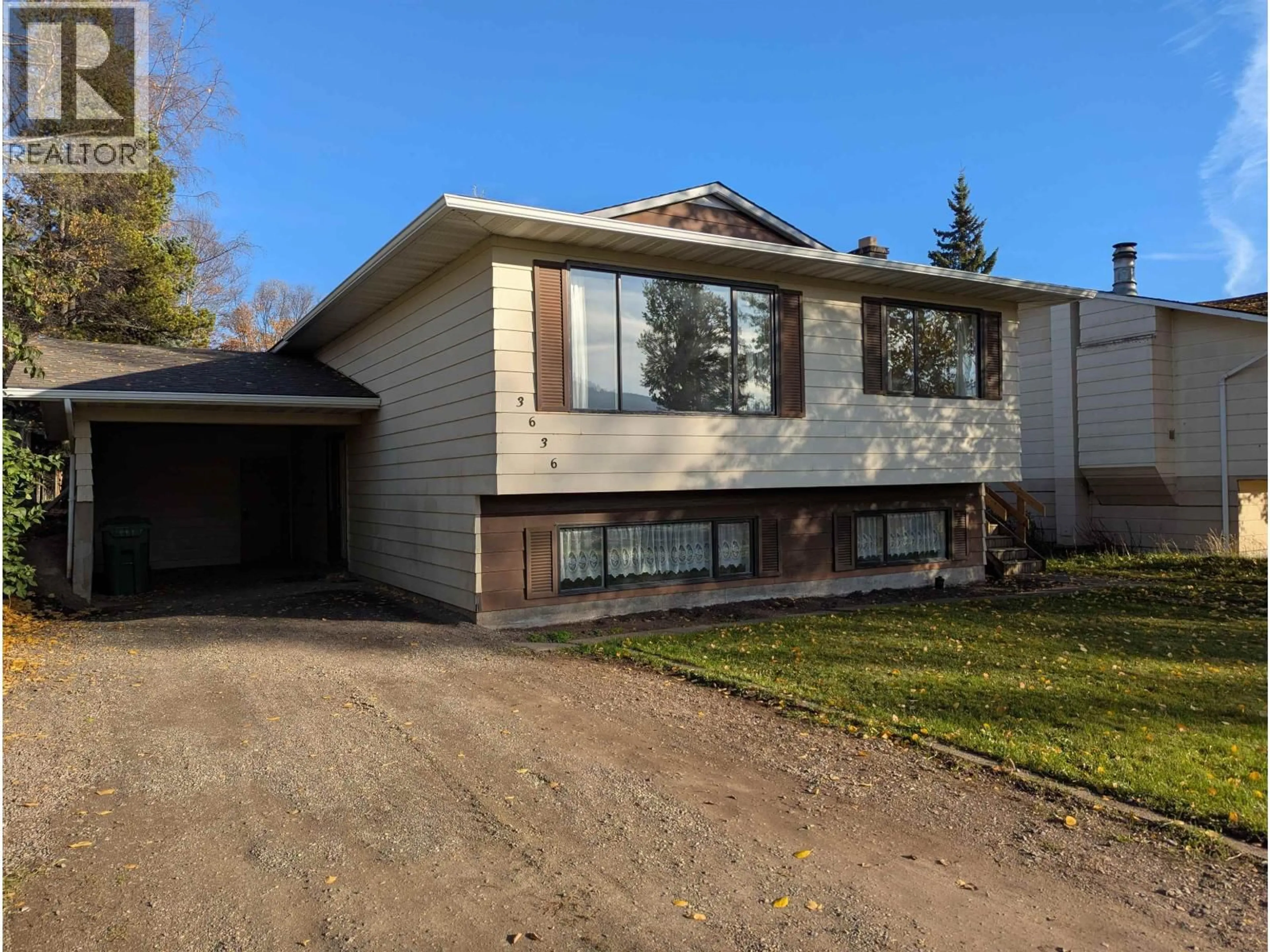 Home with vinyl exterior material, street for 3636 18TH AVENUE, Smithers British Columbia V0J2N0