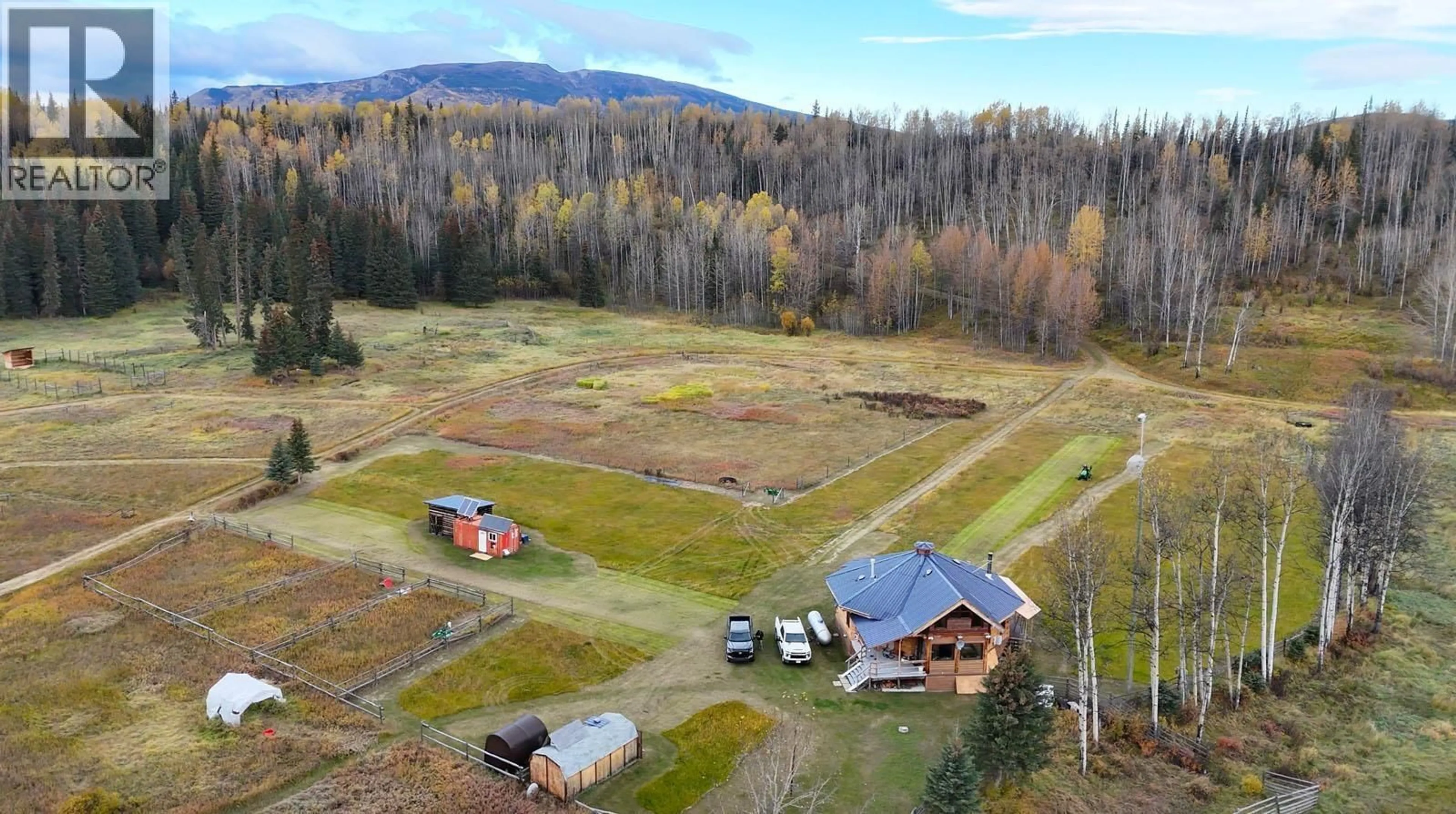 A pic from outside/outdoor area/front of a property/back of a property/a pic from drone, mountain view for 26747 PINK MOUNTAIN ROAD, Fort St. John British Columbia V0C2B0
