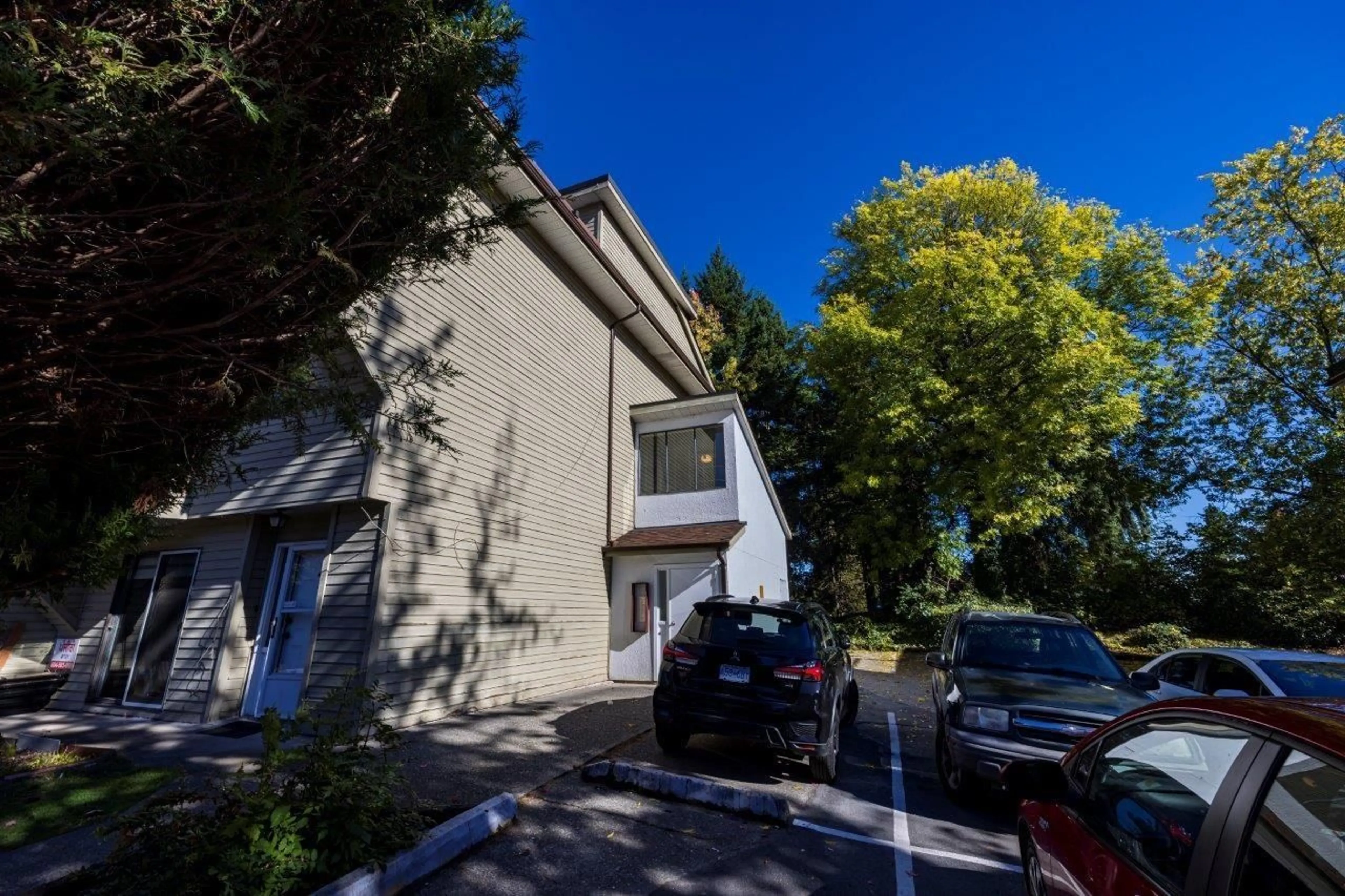 A pic from outside/outdoor area/front of a property/back of a property/a pic from drone, street for 203 - 7144 133B, Surrey British Columbia V3W8A4